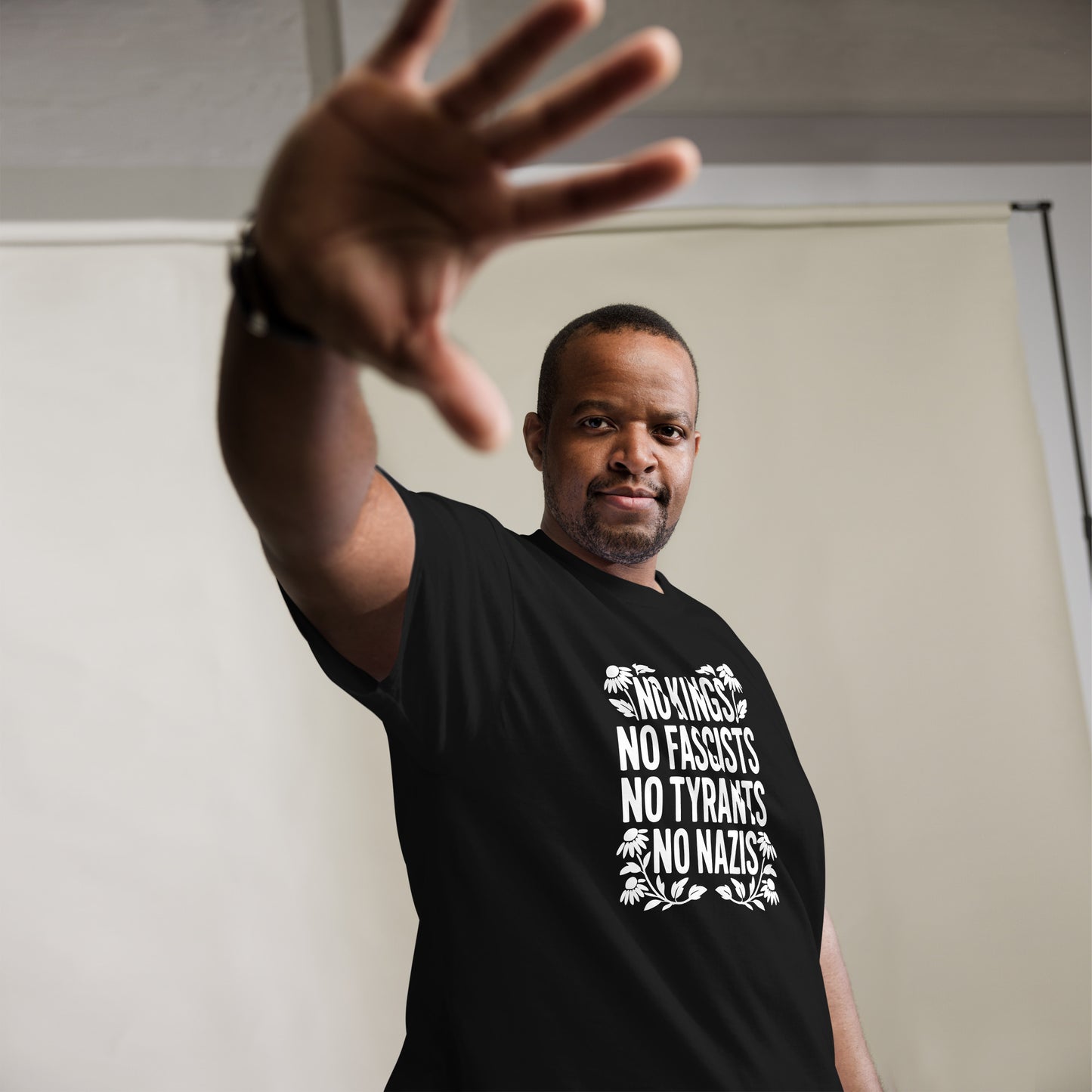 Lifestyle Image: Black activist wearing No Kings No Fascists No Tyrants No Nazis” shirt