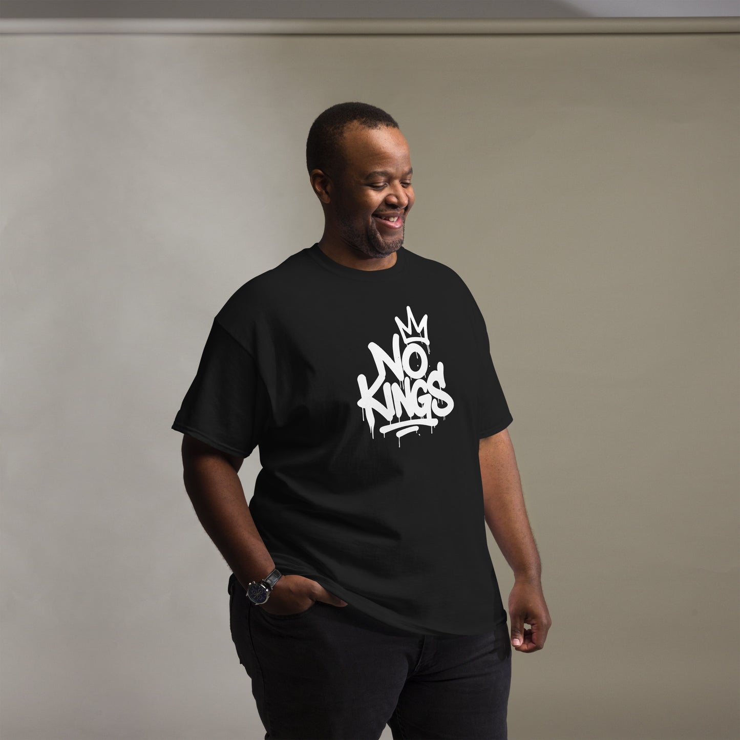Lifestyle Image: Black Male Protester wearing No Kings tee during street demonstration
