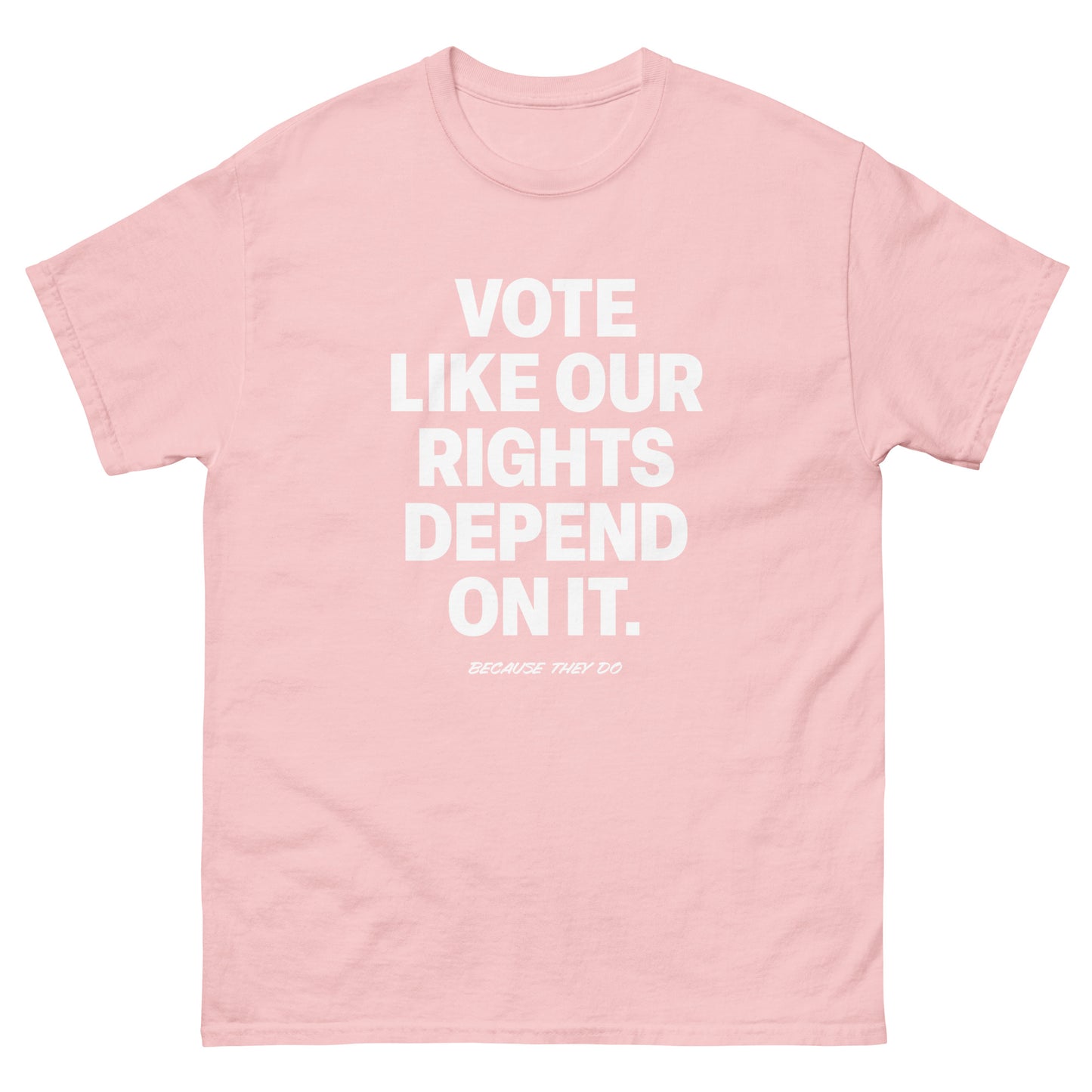 Soft pink unisex t-shirt featuring bold voting statement in minimalist white lettering.