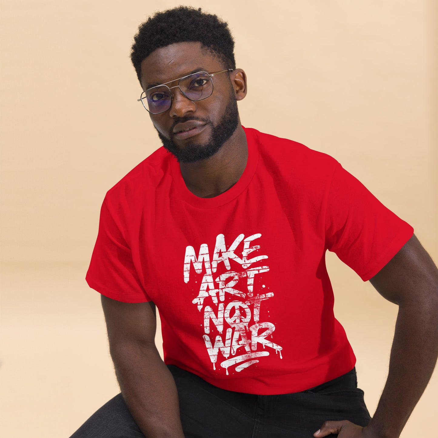 Black male advocate wearing the "Make Art Not War" Graffiti Brick Wall Anti-War Unisex Classic Tee