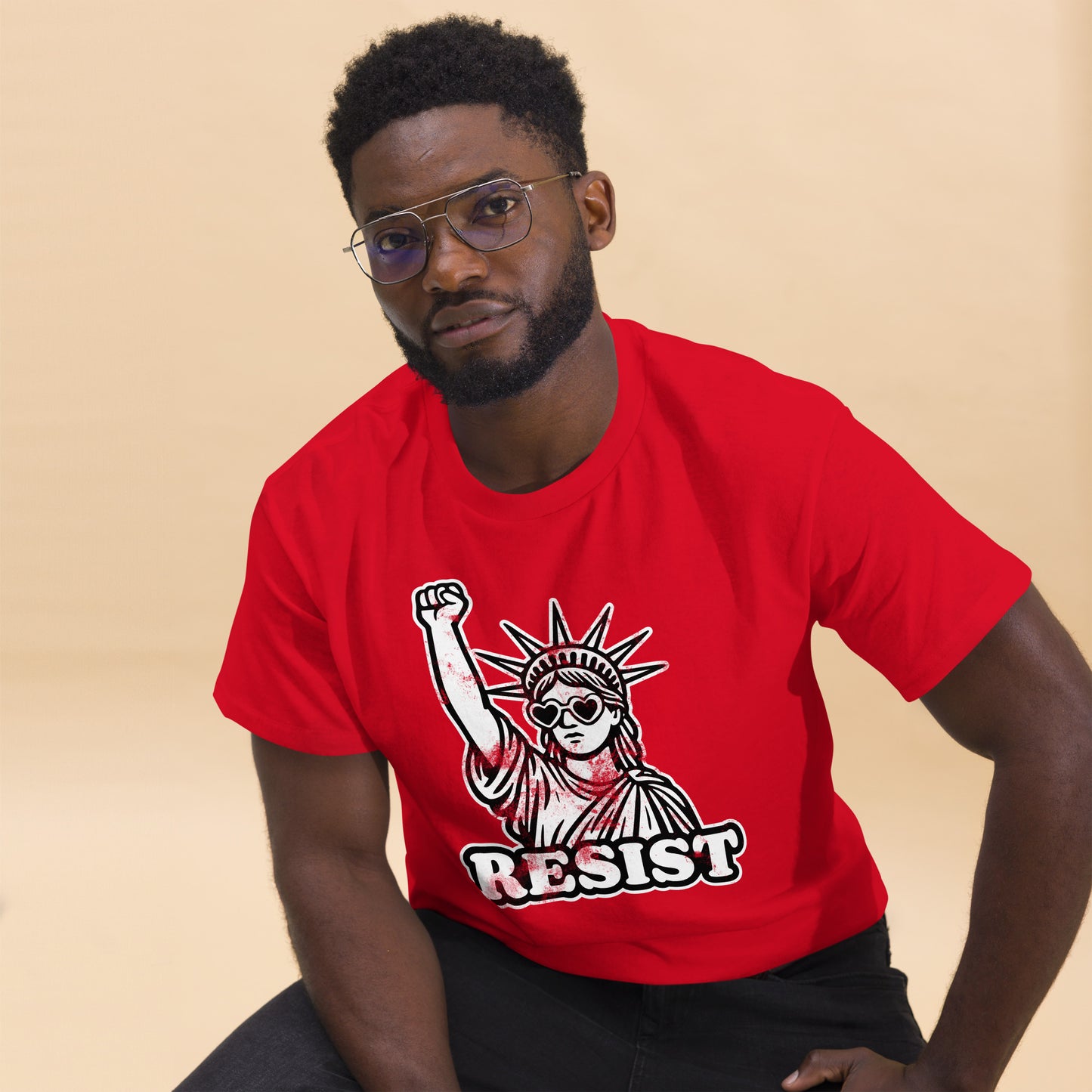 Lifestyle Image: Black male protester wearing Statue of Liberty protest tee - red