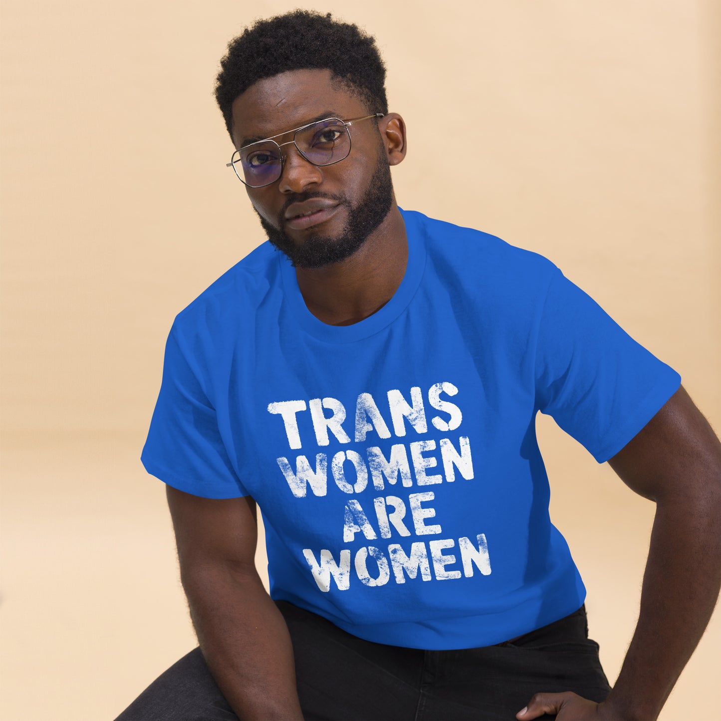 Black male trans rights advocate wearing the "Trans Women Are Women" Trans Rights Distressed Tee