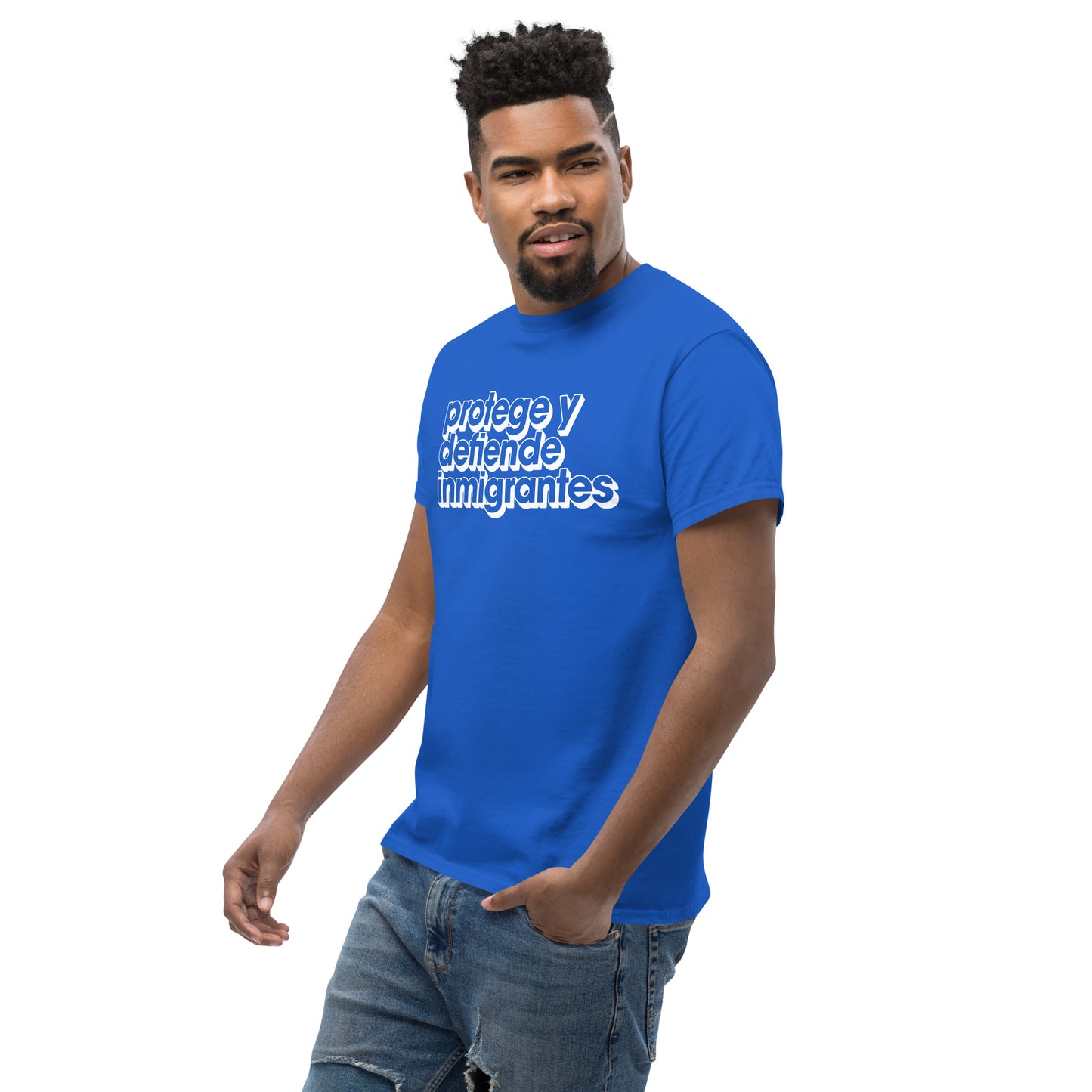 Lifestyle Image: Black Model wearing Protege y Defiende Inmigrantes pro-migrant rights unisex shirt