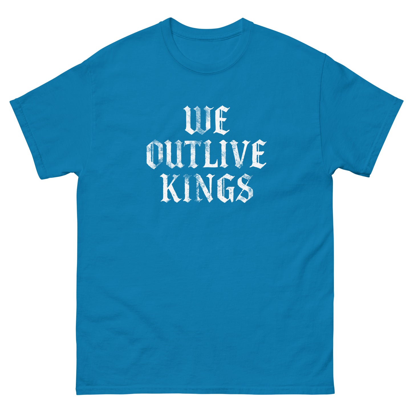 Teal blue unisex classic tee displaying white blackletter “WE OUTLIVE KINGS” phrase, anti-authoritarian political apparel with bold democracy message.