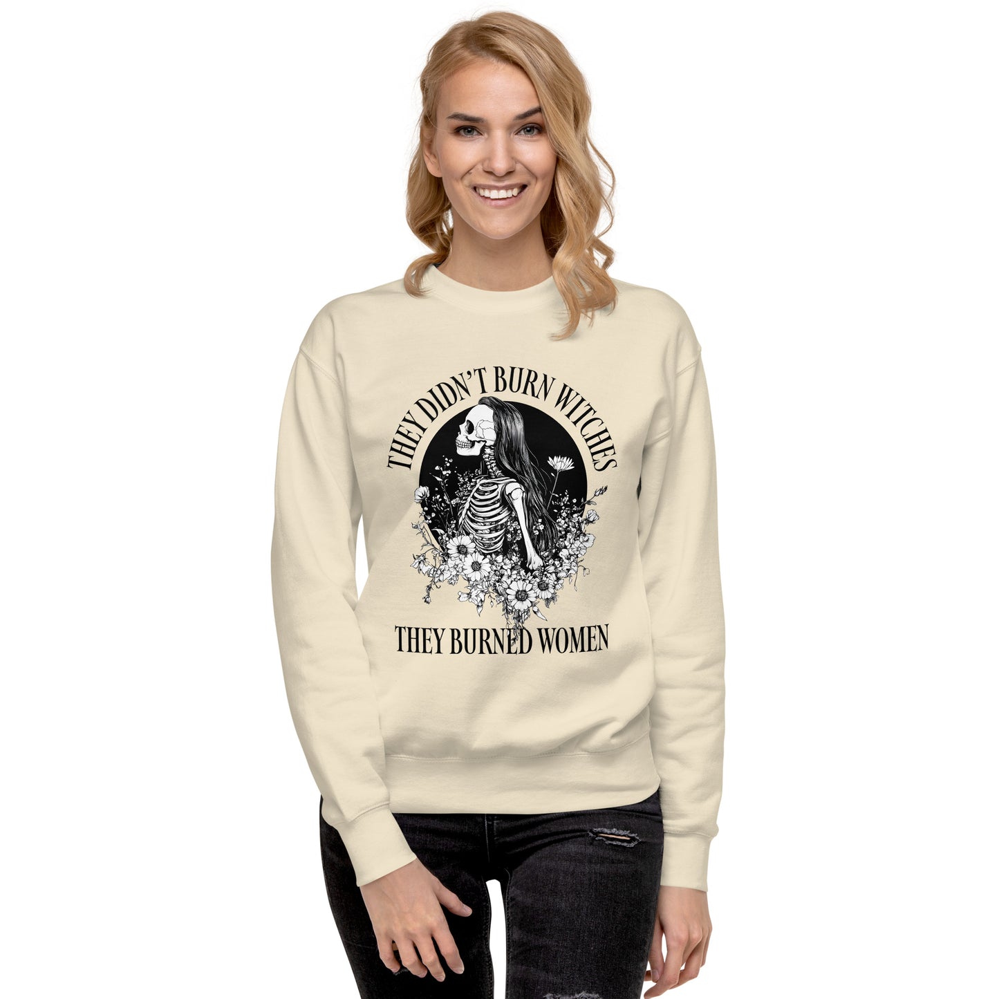 Model wearing the They Didn’t Burn Witches They Burned Women unisex premium sweatshirt, showcasing its bold design.