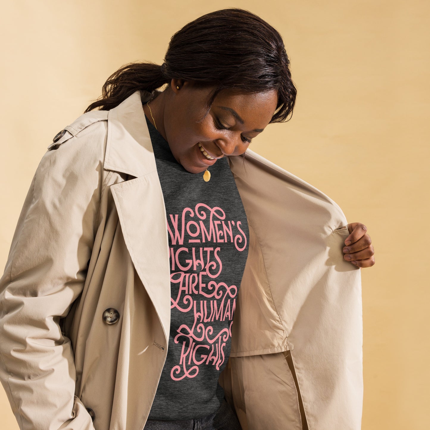 Lifestyle Image: A black woman wearing the sweatshirt at a protest, advocating for women’s rights.