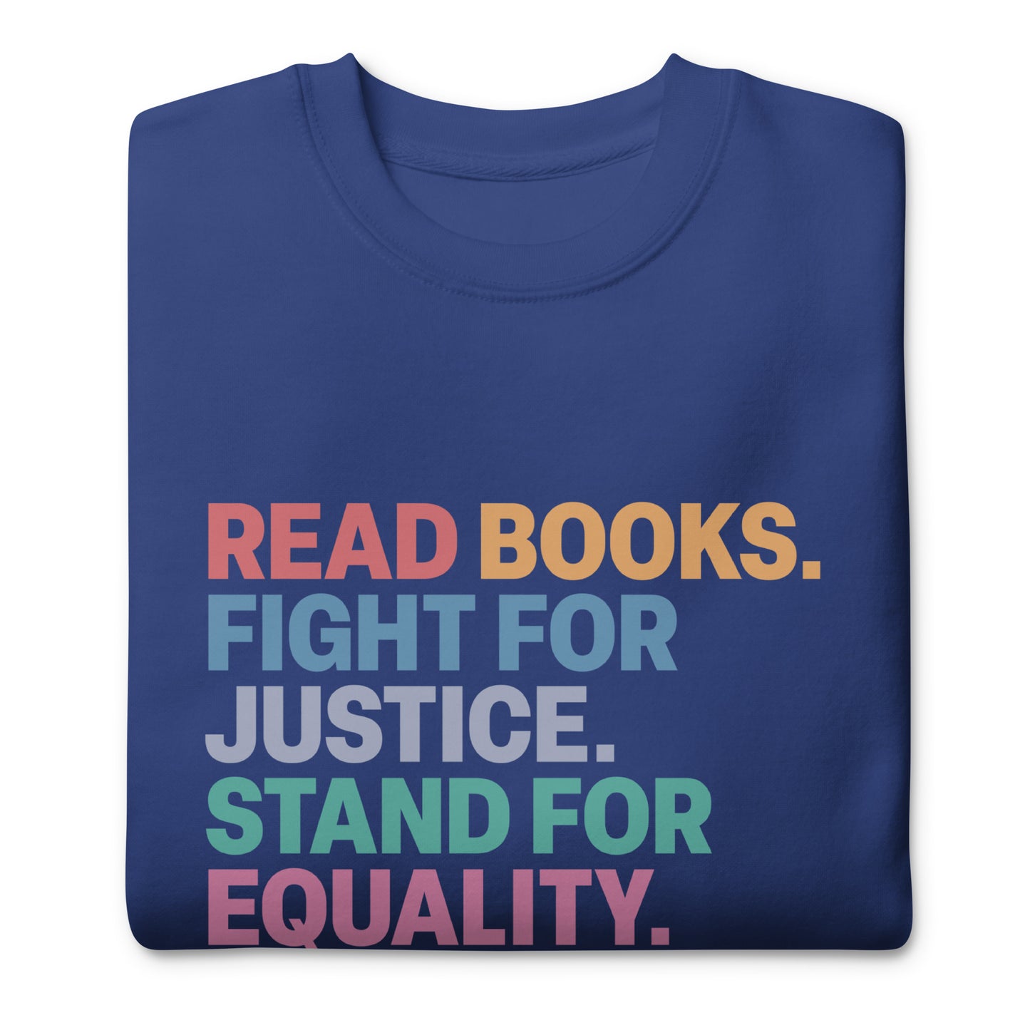 Close-up of impactful social justice slogan printed on sweatshirt with “Read Books. Fight For Justice. Stand For Equality. Protect The Vulnerable.” text.