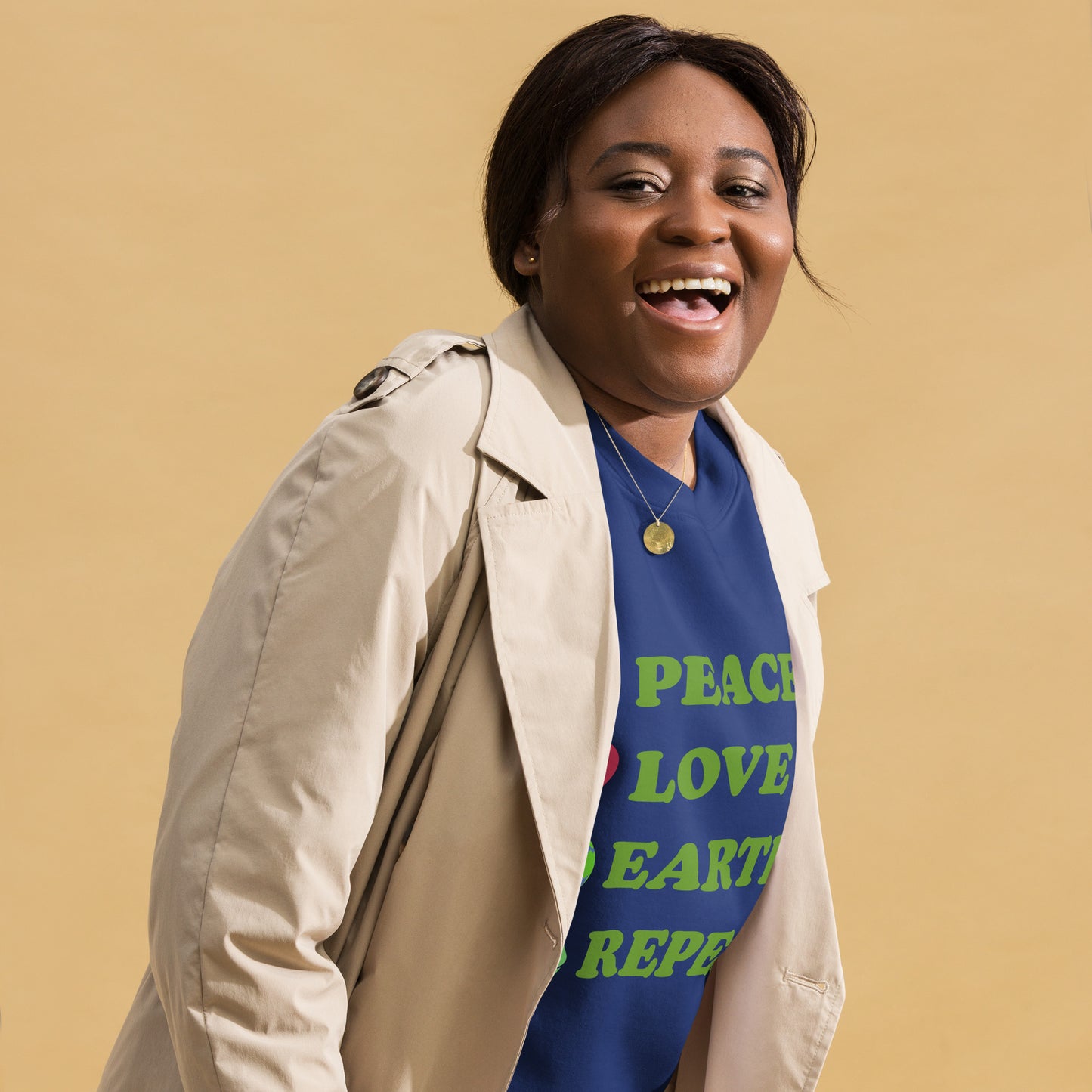 Lifestyle Image: Black woman wearing Peace Love Earth Repeat eco message sweatshirt