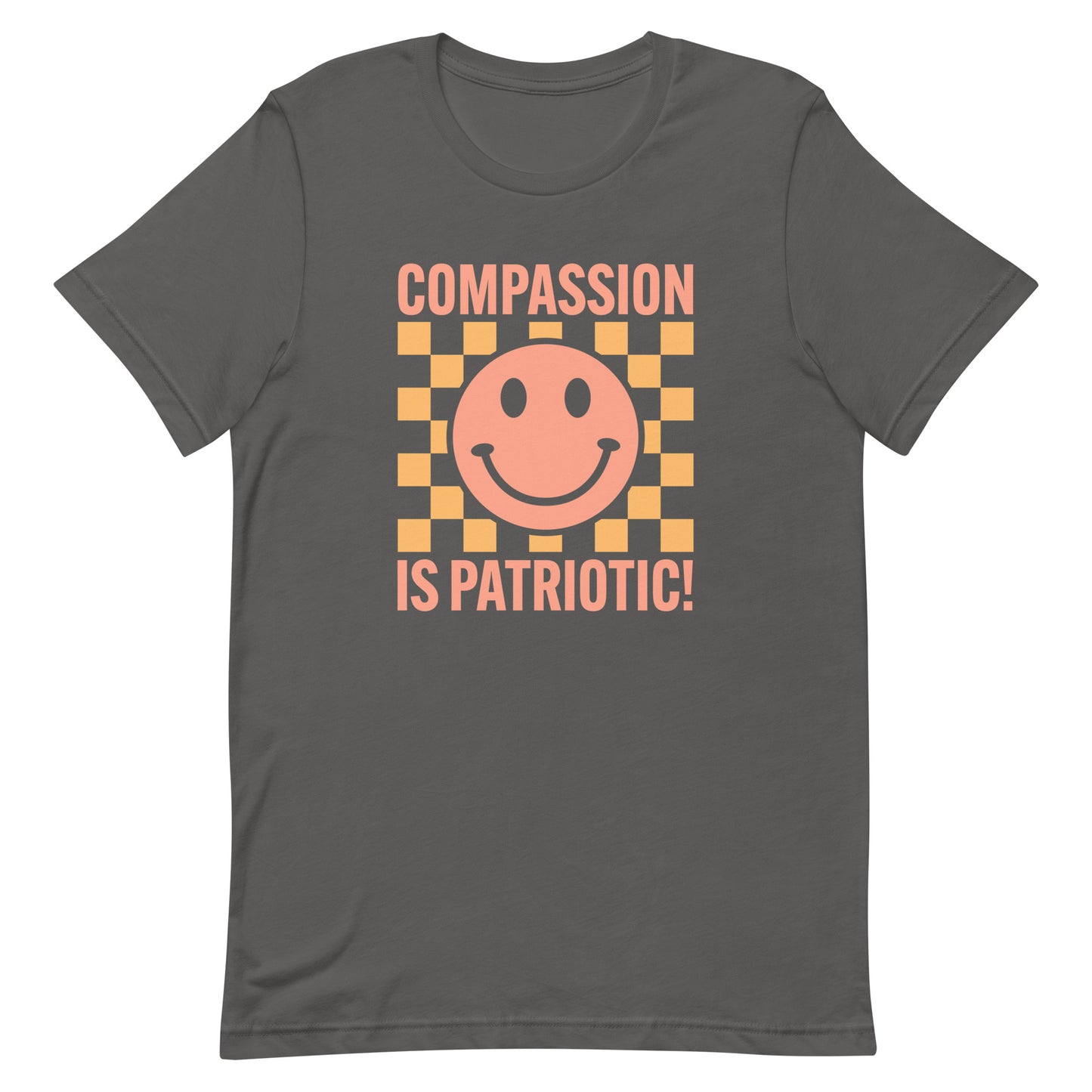 Front view of the Compassion Is Patriotic Smiley Face Unisex T-Shirt featuring a cheerful smiley design and bold text.