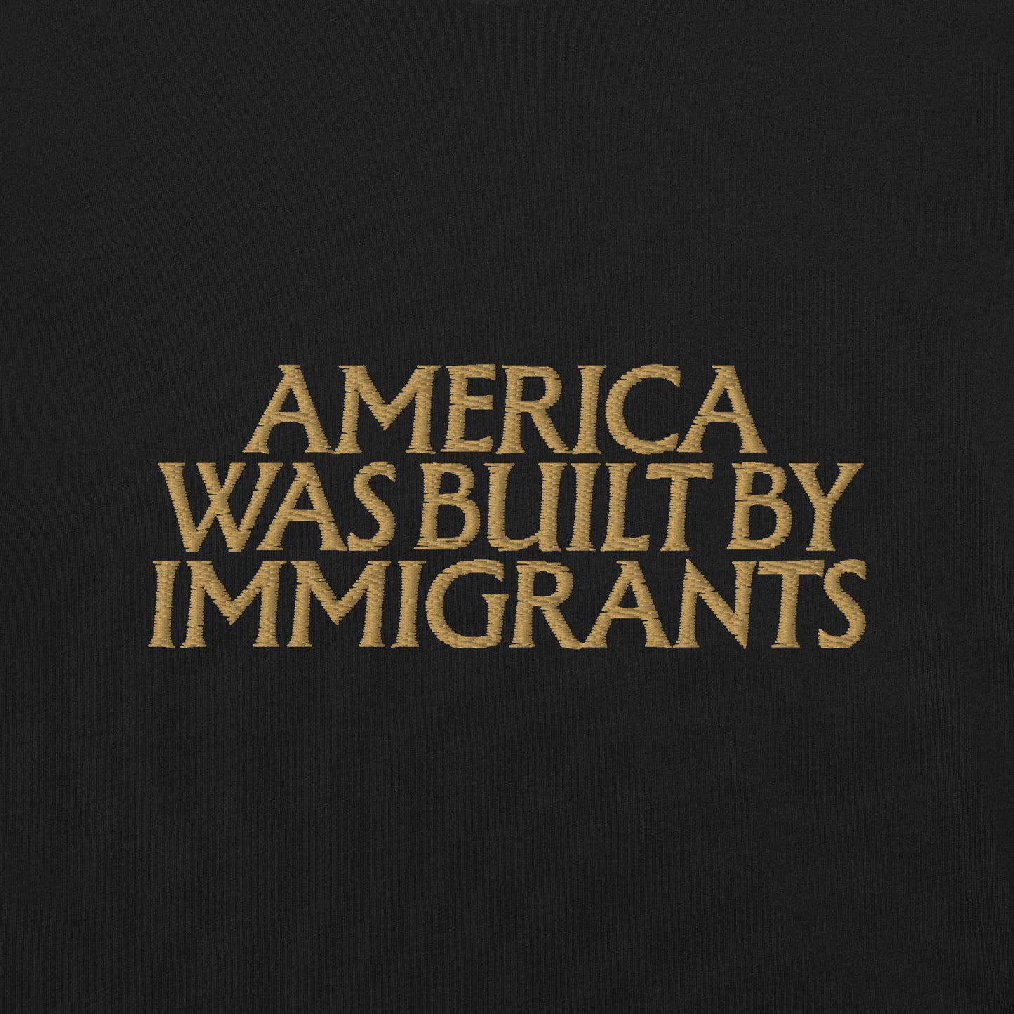 Close up detaied view of the "America Was Built By Immigrants" Pro-Immigrant Embroidered Unisex T-Shirt