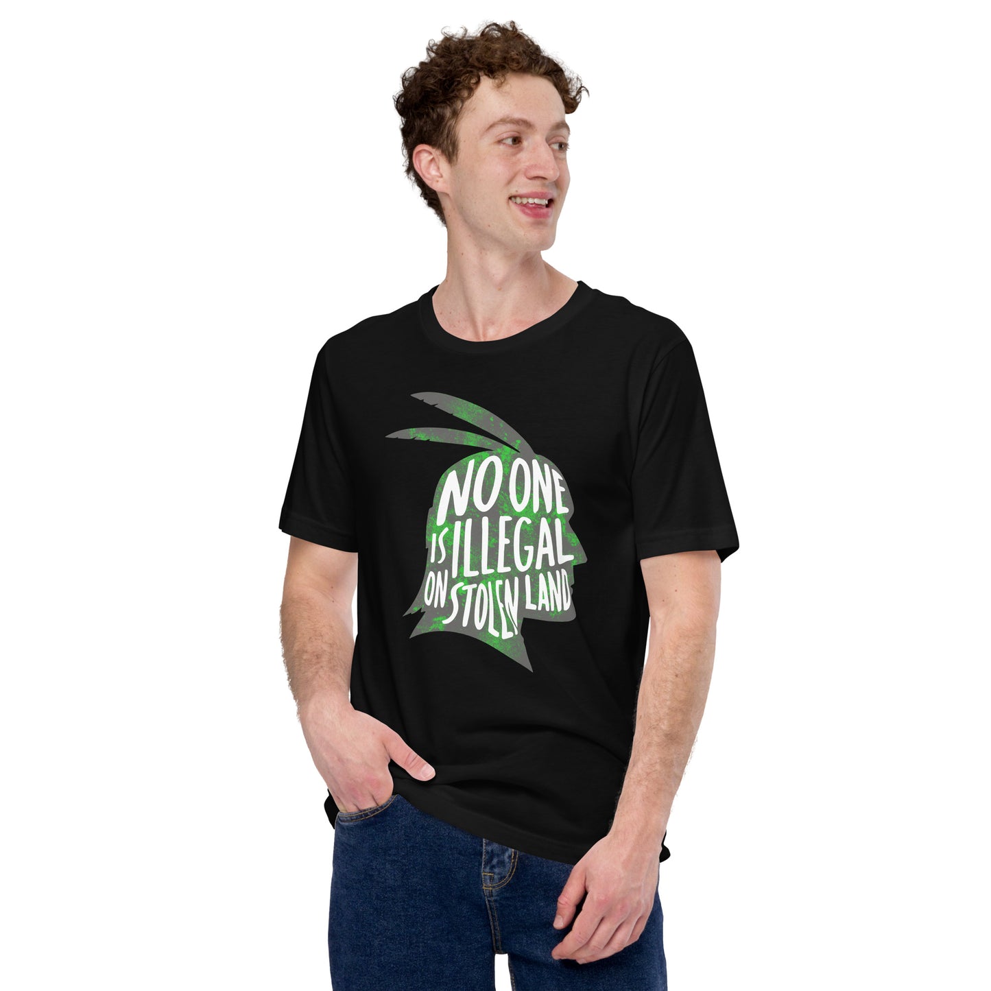 Lifestyle Image: Male advocate wearing the No One Is Illegal On Stolen Land Graphic Unisex Tee