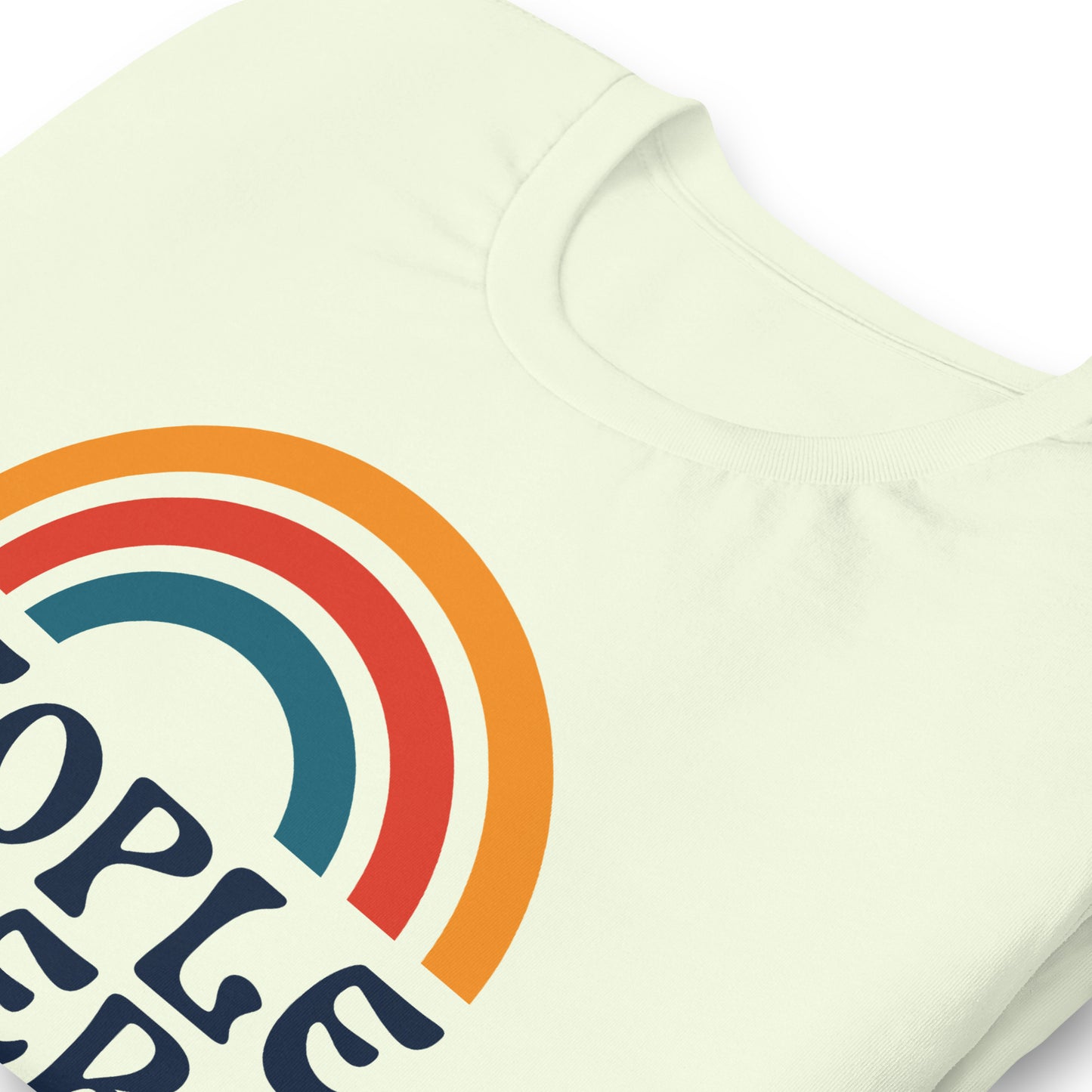 Close-up of retro rainbow graphic with “People Over Profit” text.