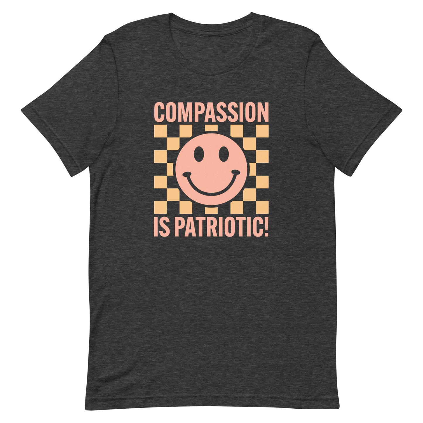 Front view of the Compassion Is Patriotic Smiley Face Unisex T-Shirt featuring a cheerful smiley design and bold text.