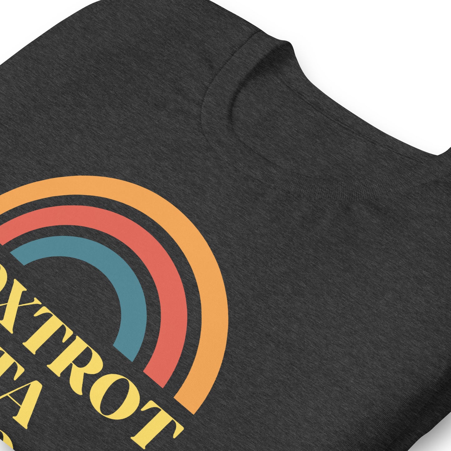 Close-up of the retro-colored rainbow and bold Foxtrot Delta Tango phrase.