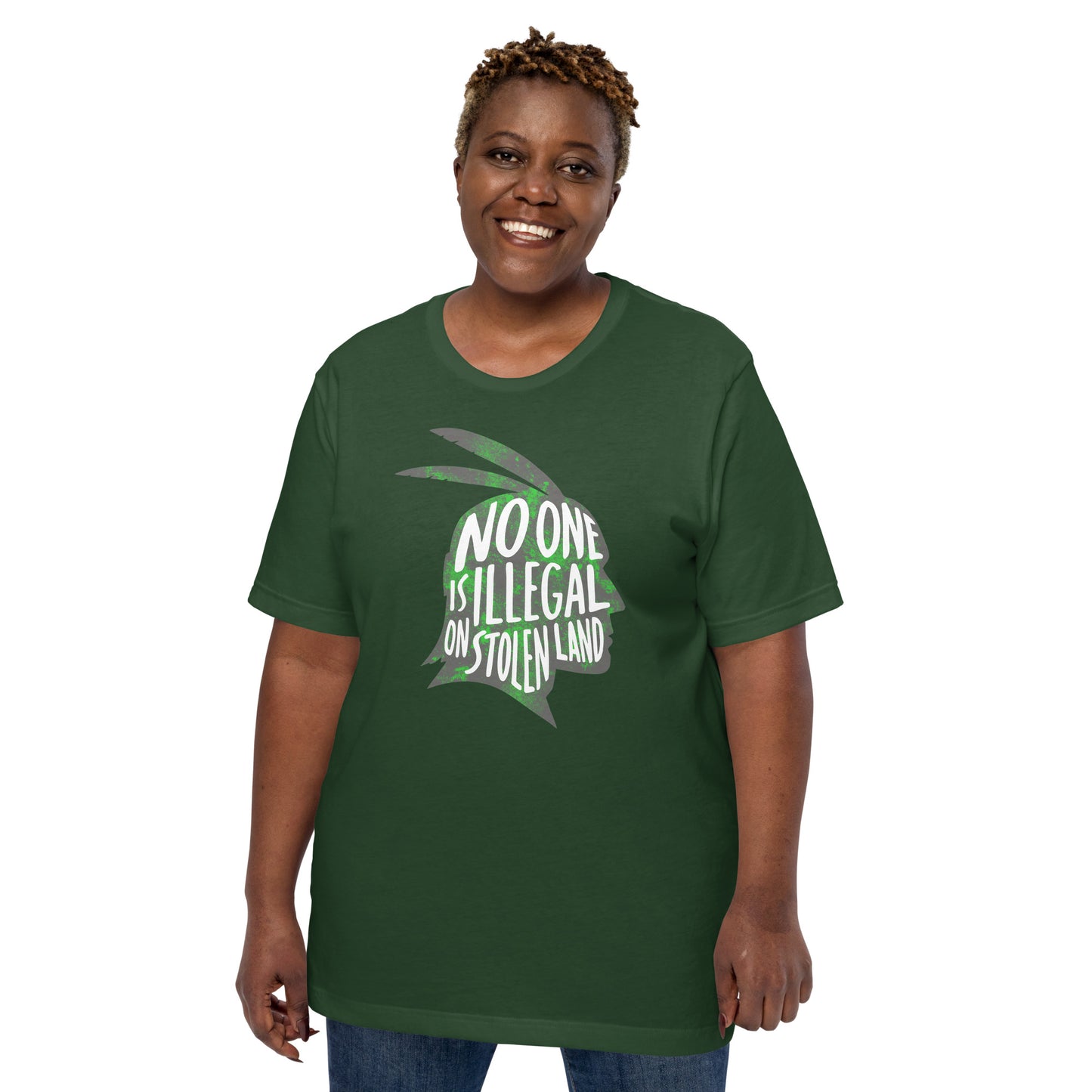 Lifestyle Image: Black female advocate wearing the No One Is Illegal On Stolen Land Graphic Unisex Tee