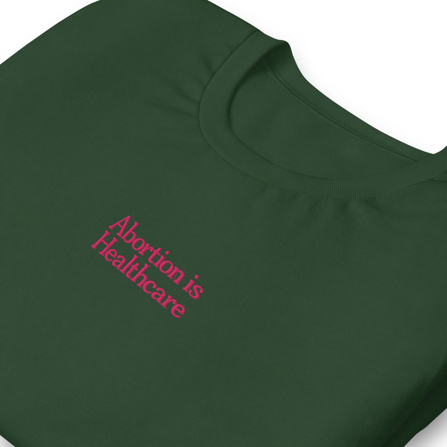 Detail view of the"Abortion Is Healthcare" Reproductive Rights Embroidered Unisex T-Shirt