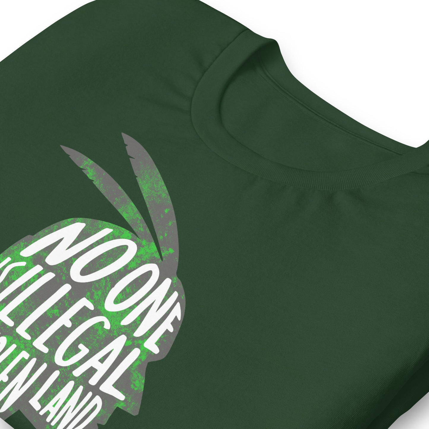 Close up image of the No One Is Illegal On Stolen Land Graphic Unisex Tee