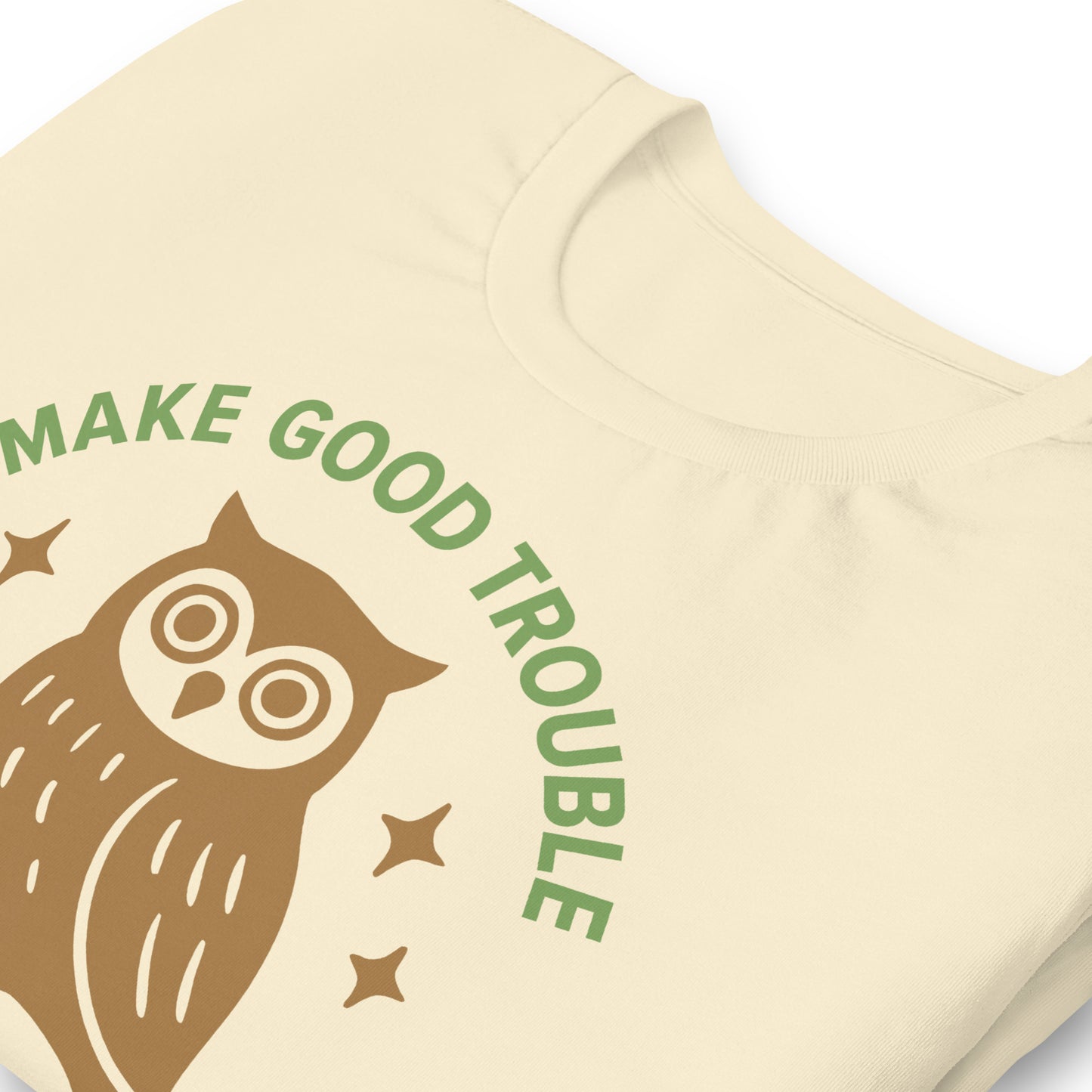 Close-up of wise owl graphic with sparkles and activist Make Good Trouble quote in green text