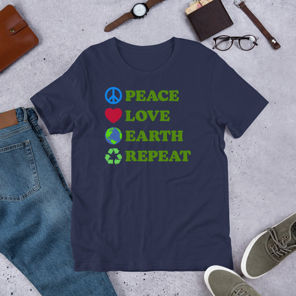 Flat Lay Image: Peace Love Earth Repeat Tee styled with accessories on neutral background