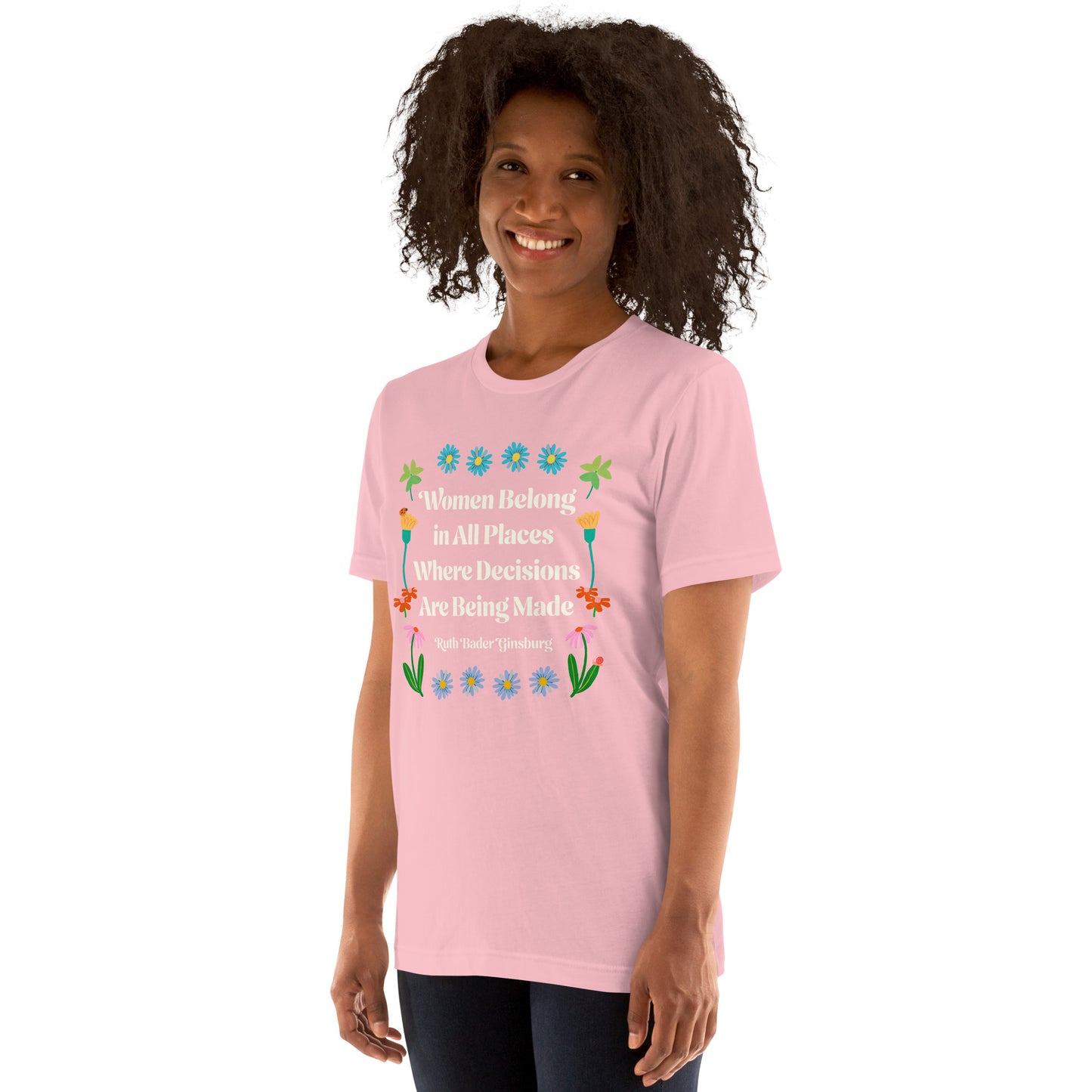 Lifestyle Image: Black woman wearing the Women Belong In All Places Where Decisions Are Being Made Unisex T-Shirt featuring floral design.