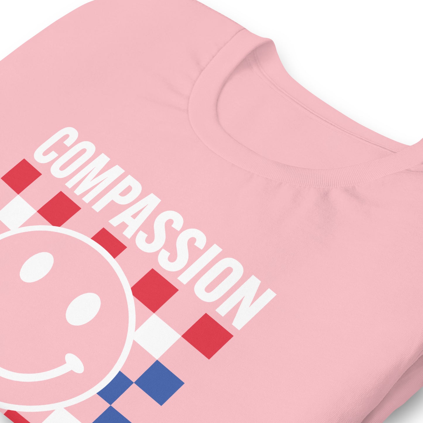 Close-up of the smiley face and Compassion Is Patriotic text in red, white, and blue.