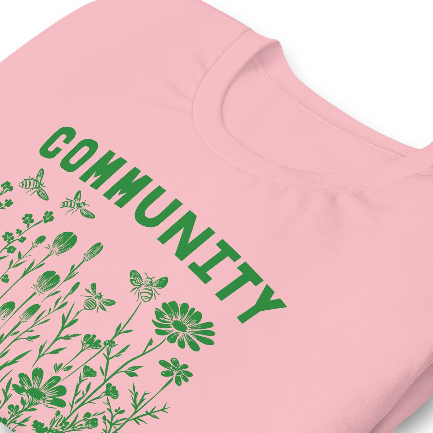 Close-Up of Design: Detailed shot of the "Community Is Resistance" text on the T-shirt.