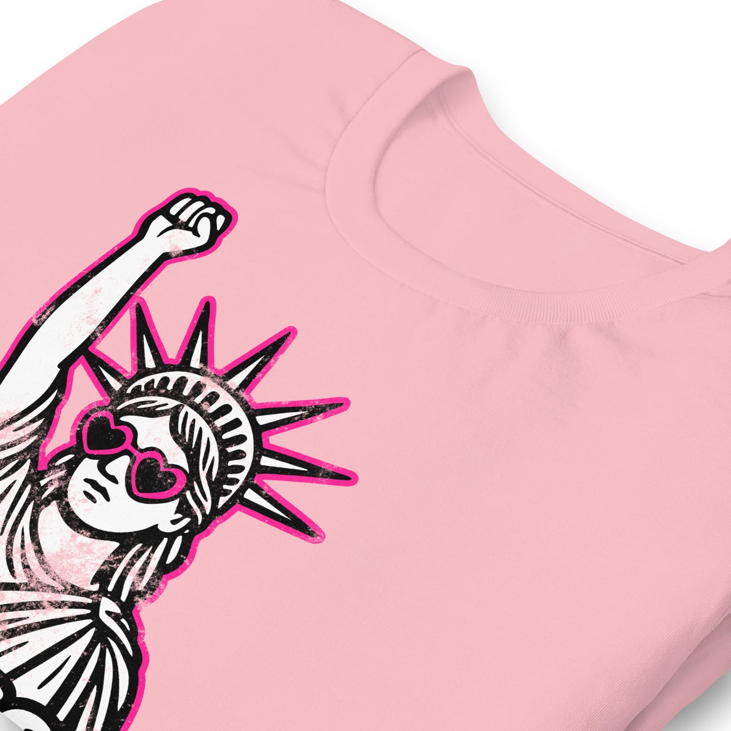 Close-Up of Design: Close-up of distressed Lady Liberty graphic with bold RESIST text and protest sunglasses - pink