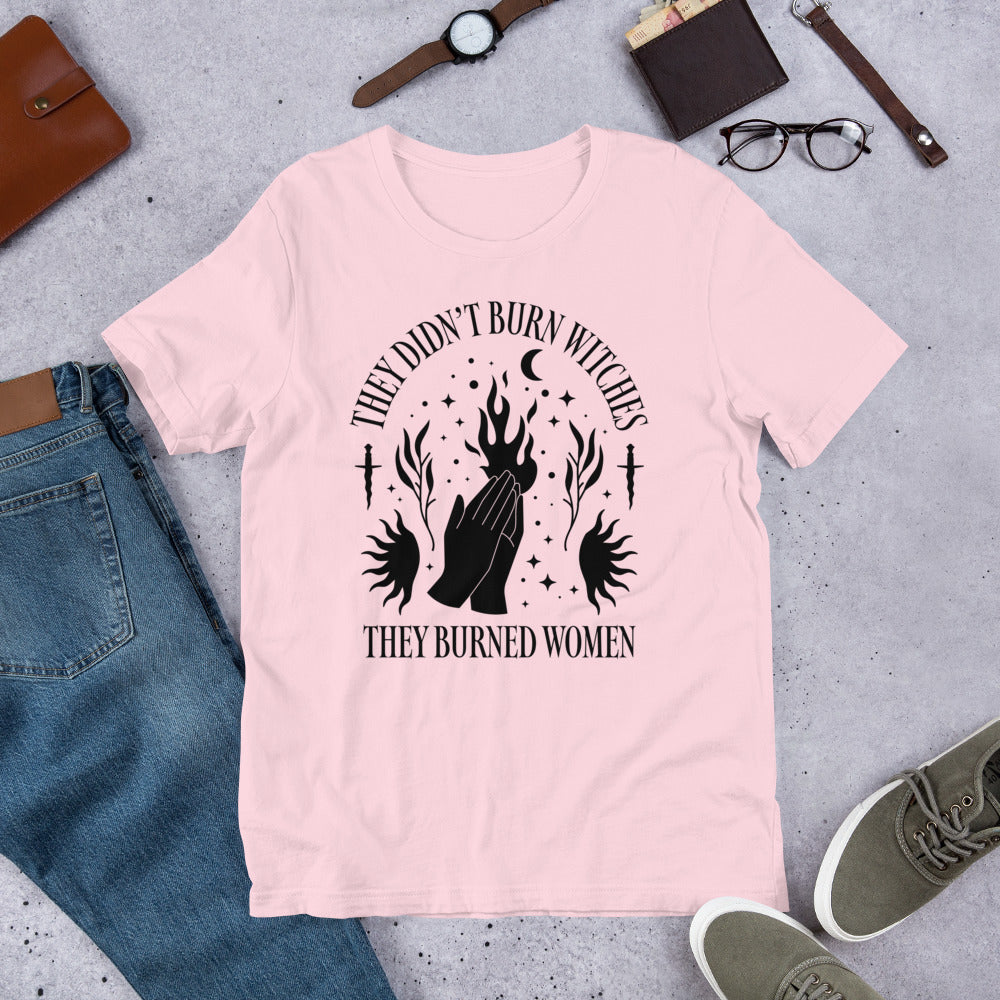 Flat lay of the Feminist History t-shirt highlighting the text “They Didn’t Burn Witches They Burned Women.”