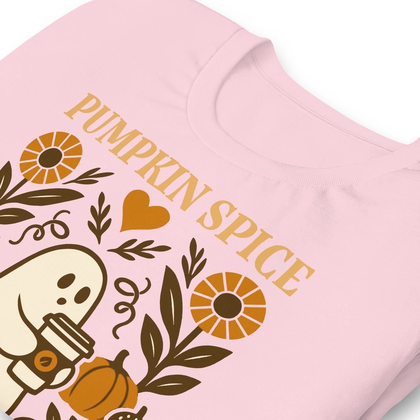 Close-up of “Pumpkin Spice & Human Rights” folk-art ghost print on pink shirt, retro progressive fall design.