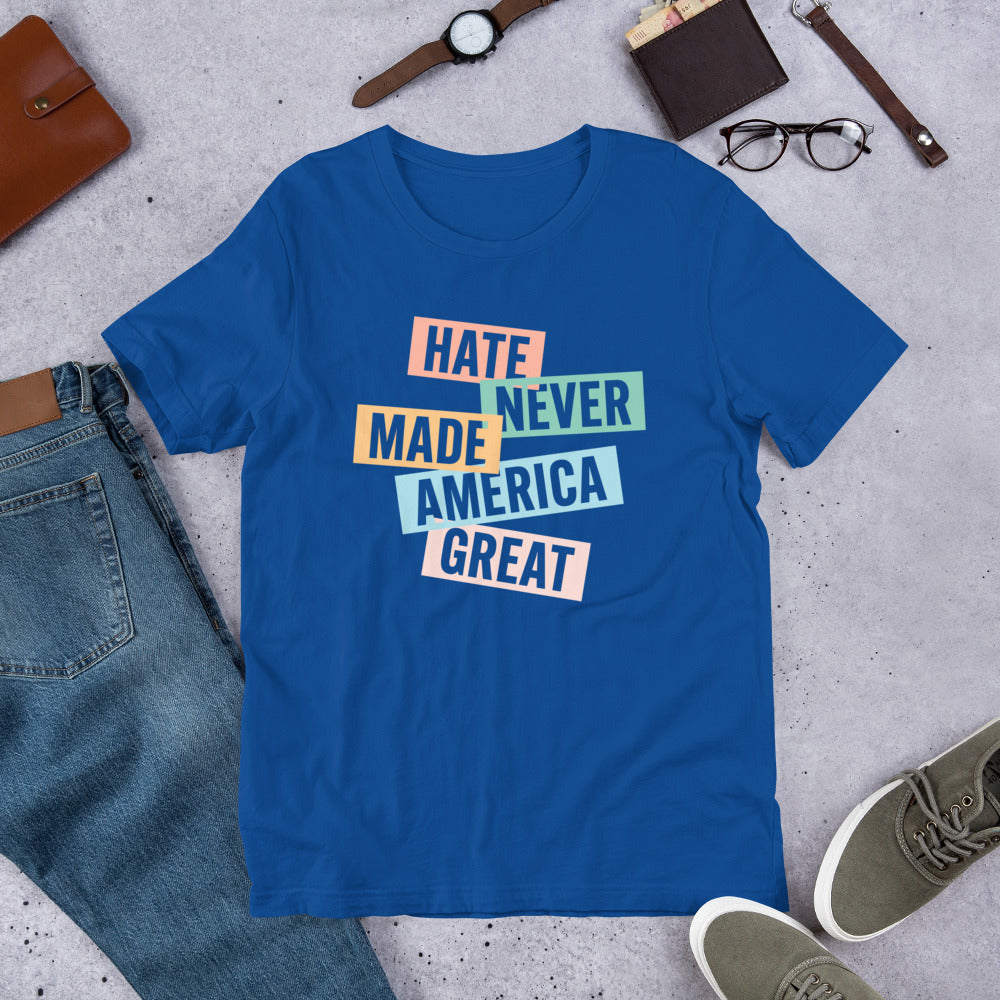 Flat lay of the Hate Never Made America Great T-Shirt styled with accessories for a casual activist look.