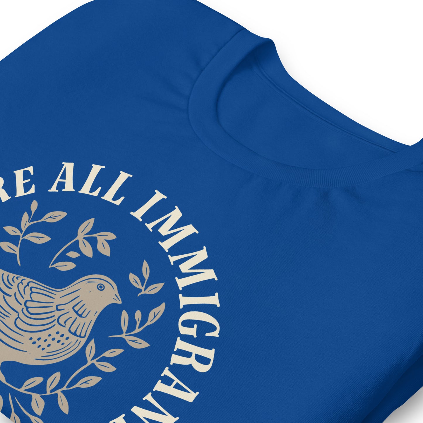 Close-up of linocut dove and leaves design with 'We Are All Immigrants' phrase.