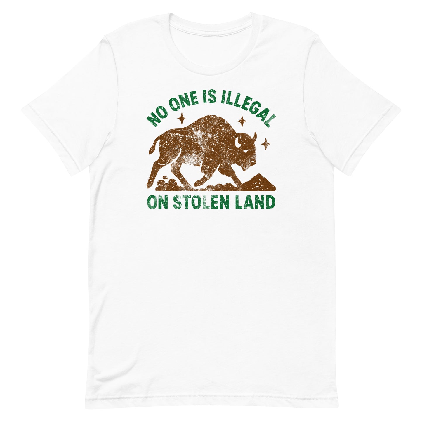 White unisex t-shirt showing the buffalo silhouette and the phrase “NO ONE IS ILLEGAL ON STOLEN LAND,” a clean, high-contrast Indigenous rights message.