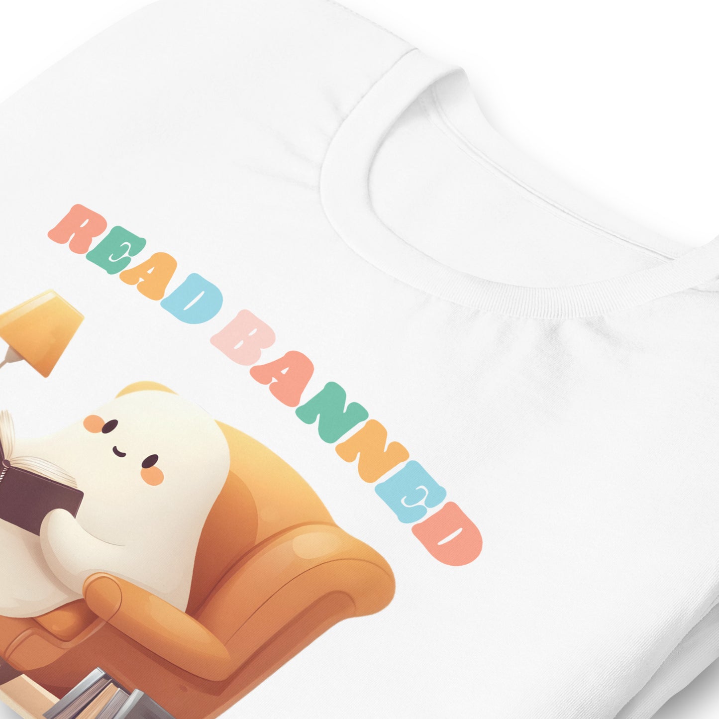close up view of the "Read Banned Boooooks" Bookish Halloween T-Shirt featuring a cute ghost reading books.