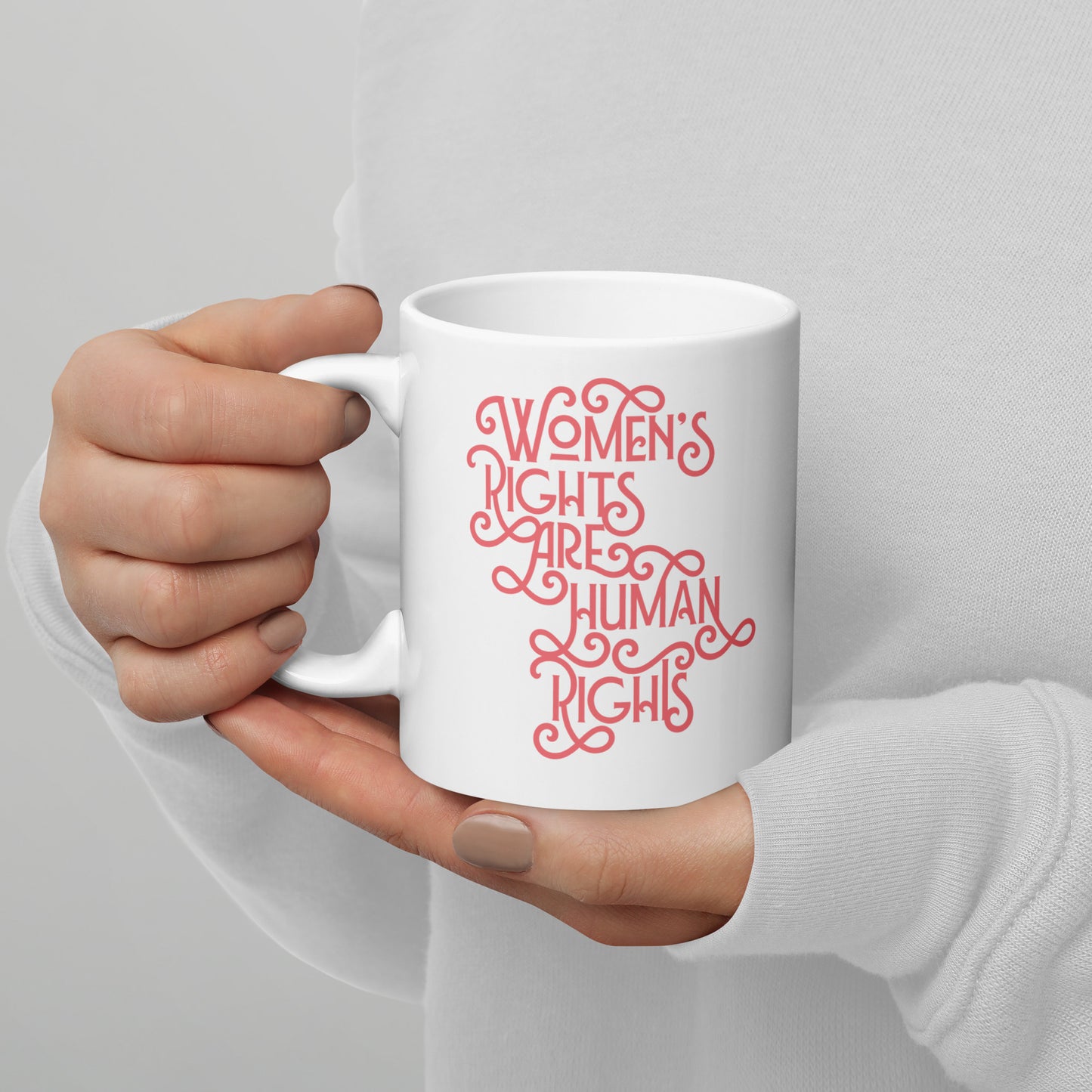 Lifestyle Image: A person holding the 11 oz feminist mug while enjoying coffee, supporting gender equality.