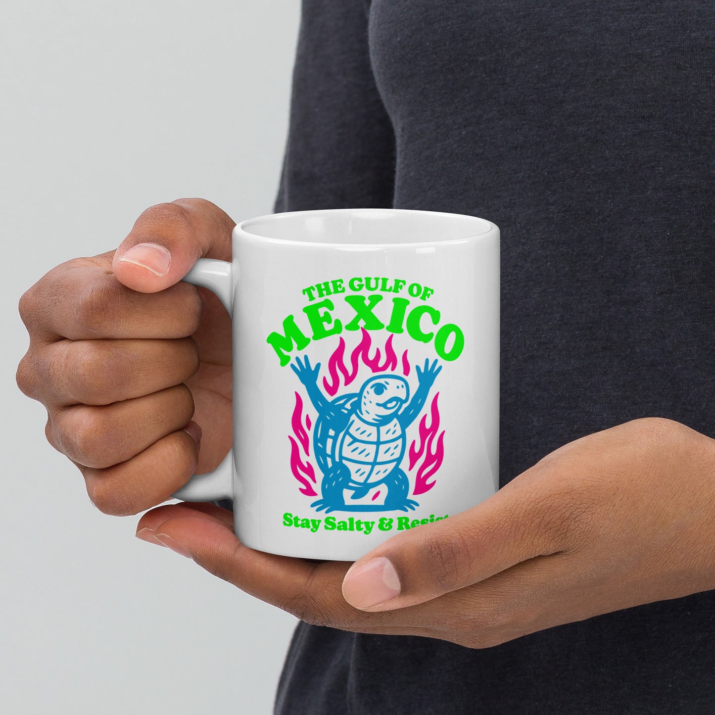 Front View Image: “Front view of 11 oz white ceramic mug featuring sea turtle and 'Stay Salty & Resist' slogan”