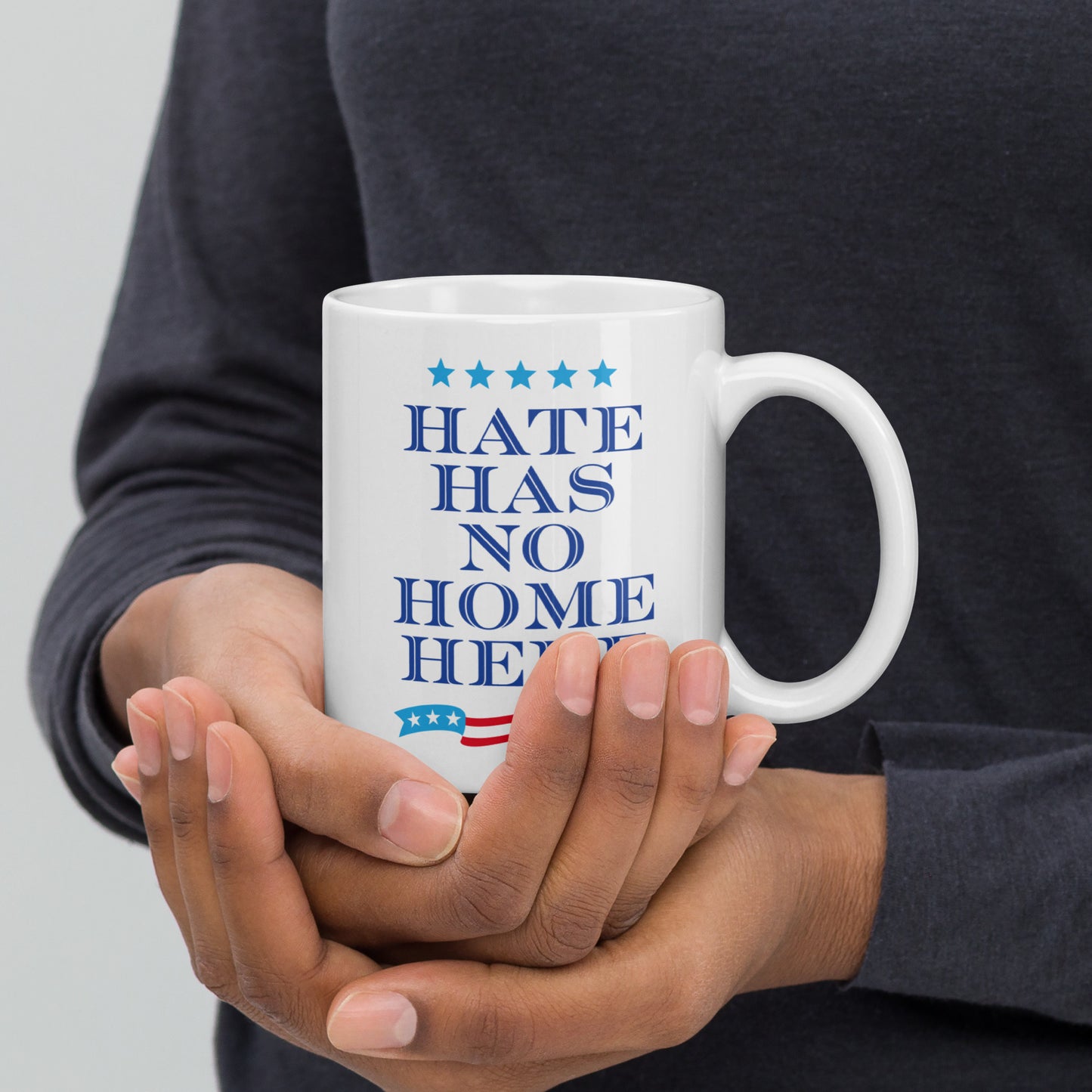 11 oz white mug featuring the Hate Has No Home Here slogan in bold text.