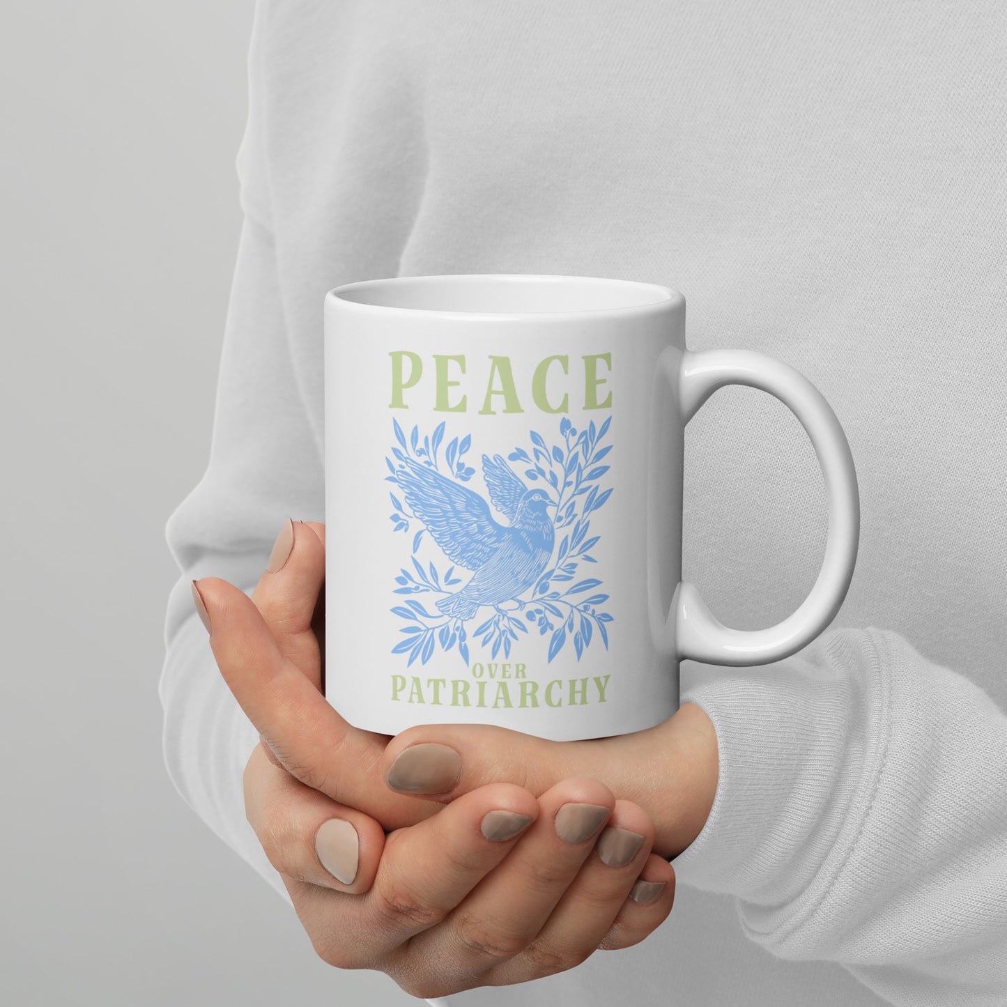 Full view of the 11 oz Peace Over Patriarchy White Mug showcasing its bold message.