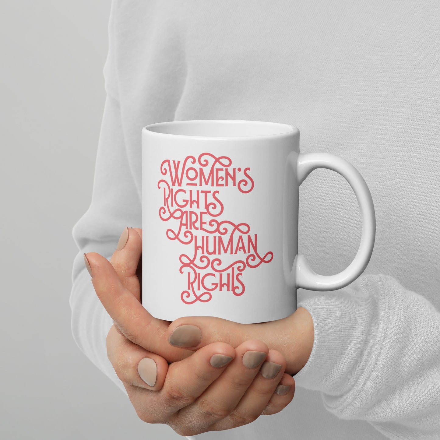 Lifestyle Image: A person holding the 11 oz feminist mug while enjoying coffee, supporting gender equality.