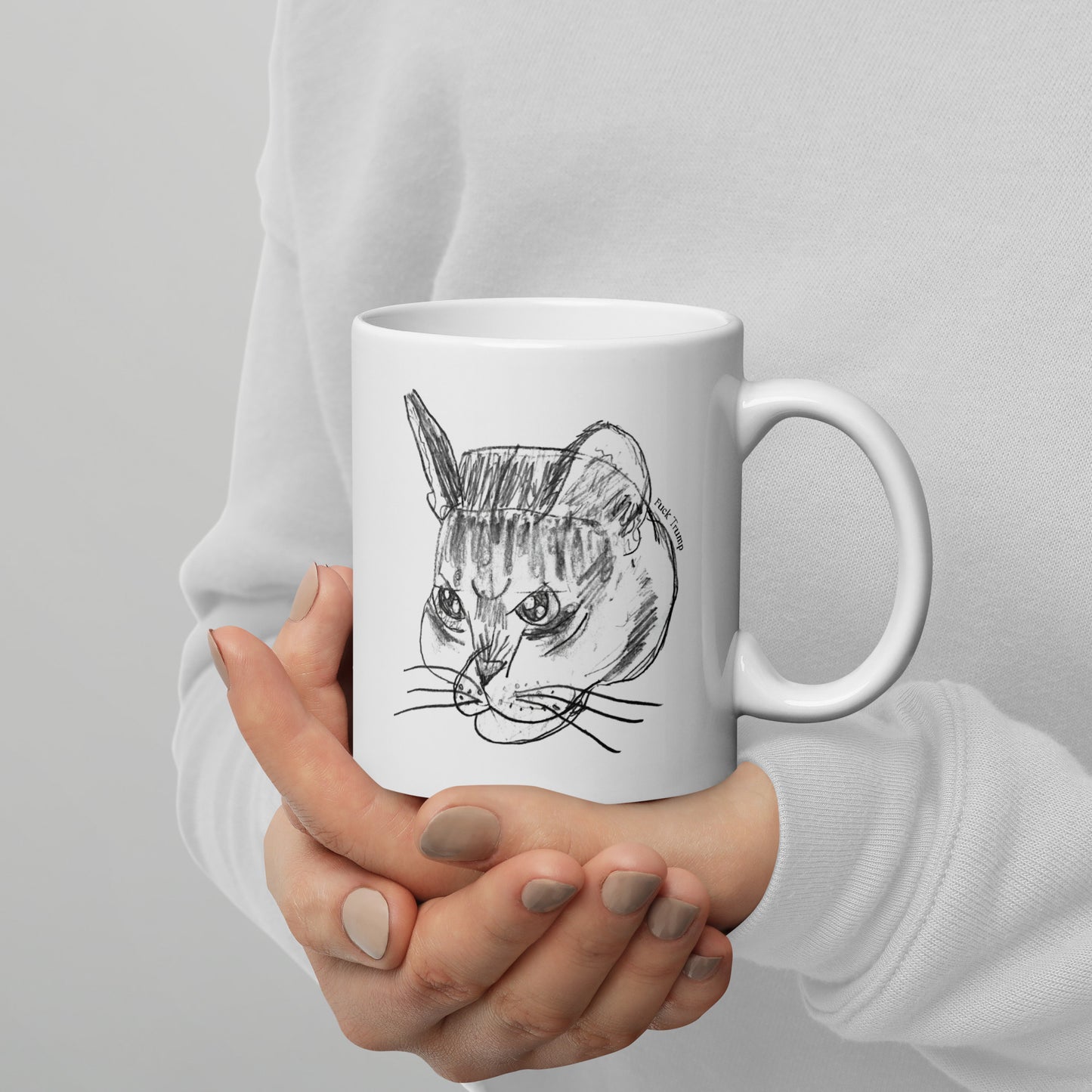 White 11 oz glossy mug featuring a funny cat illustration with a subtle anti-Trump message.