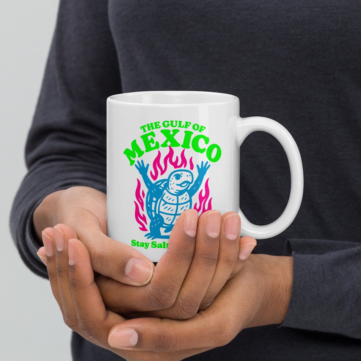 Front View Image: “Front view of 11 oz white ceramic mug featuring sea turtle and 'Stay Salty & Resist' slogan”