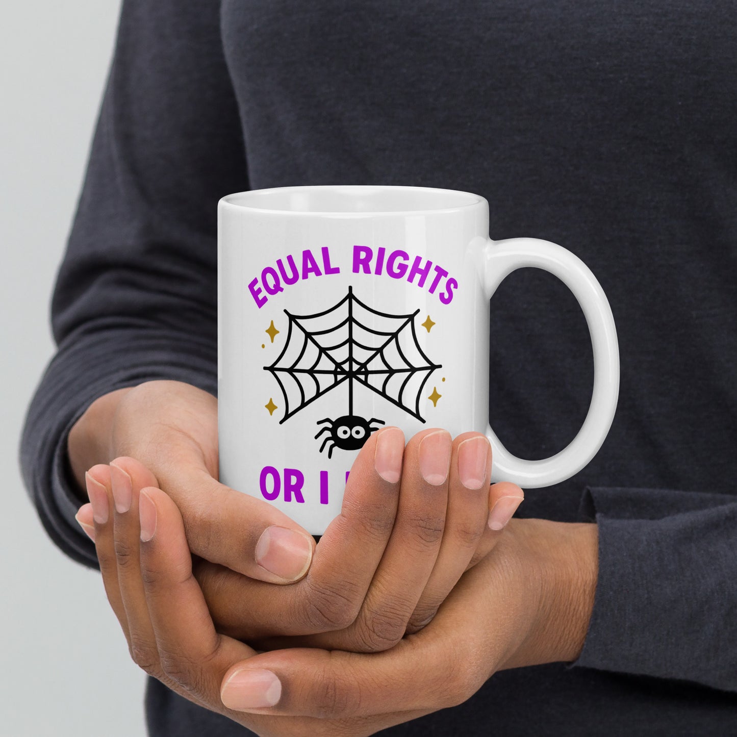 Person holding 11 oz “Equal Rights or I Bites” Halloween mug, progressive drinkware by Blue Wave USA for equality supporters.