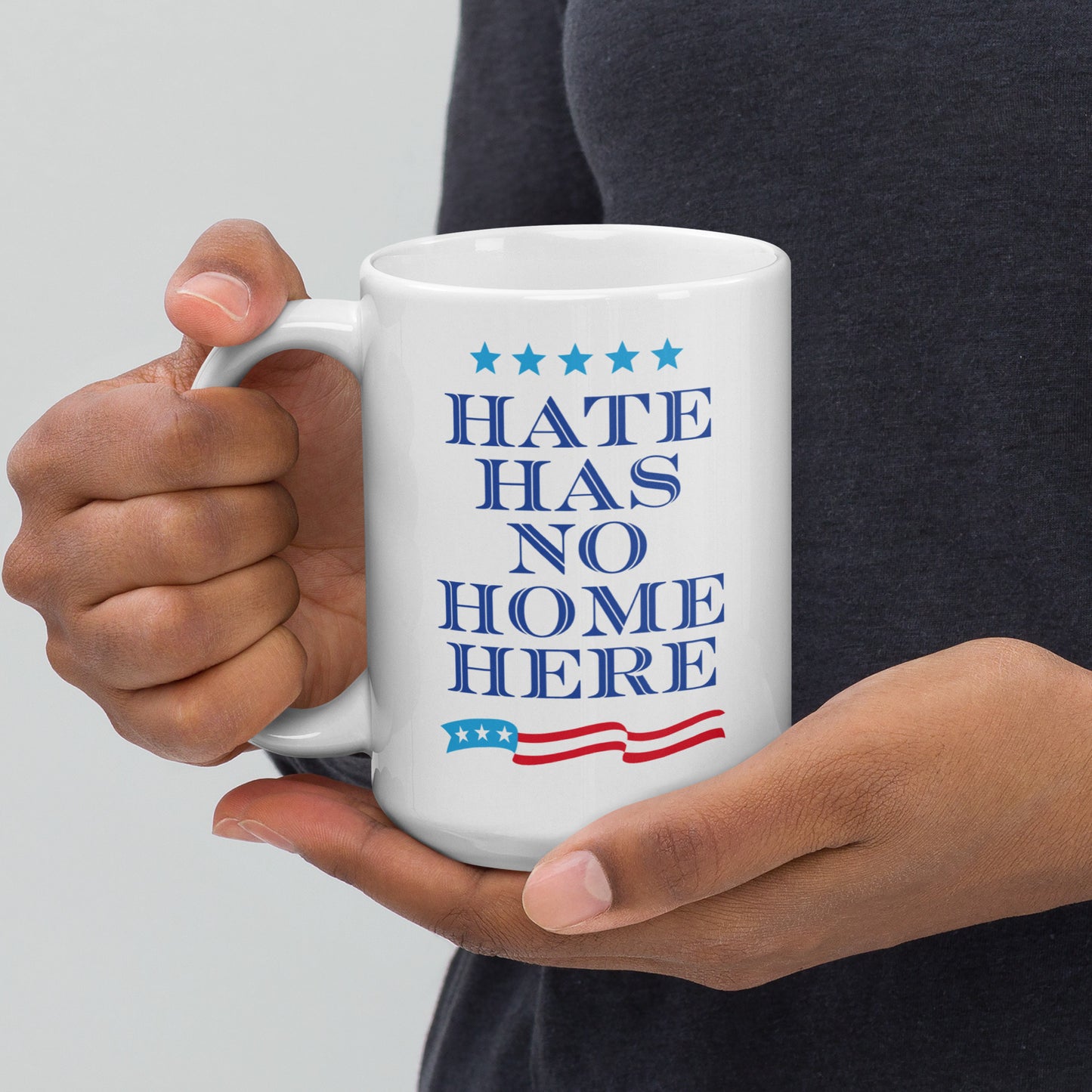 15 oz white mug featuring the Hate Has No Home Here slogan in bold text.