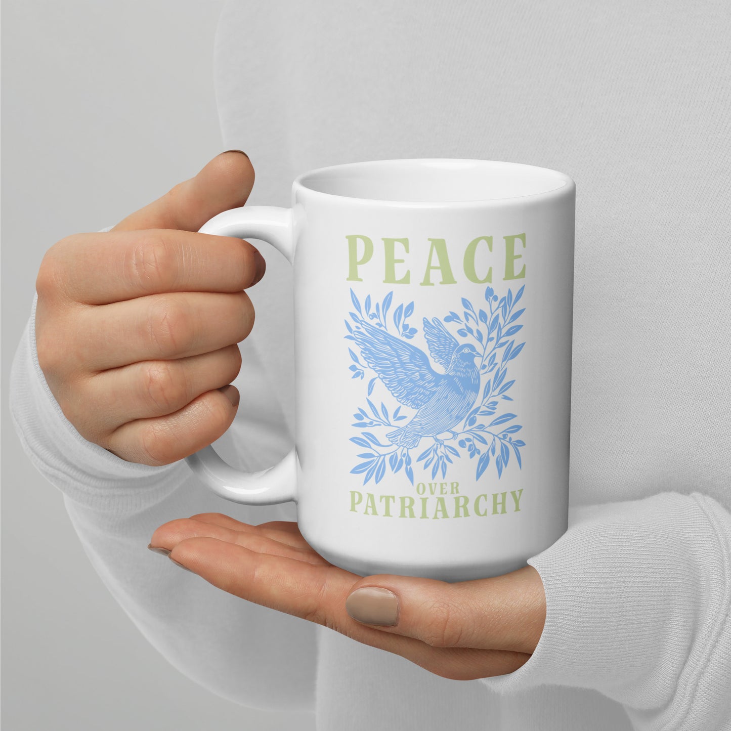 Full view of the 15 oz Peace Over Patriarchy White Mug showcasing its bold message.