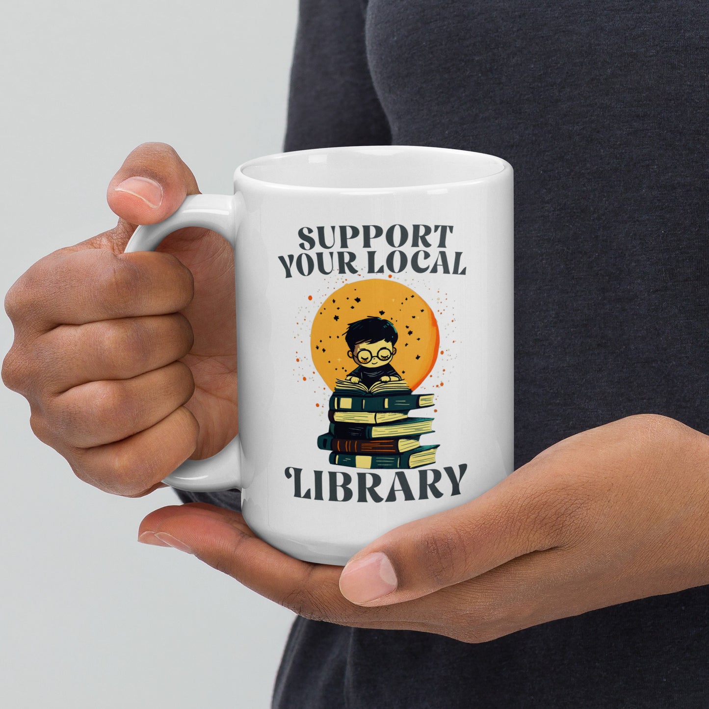 15 oz Support Your Local Library Mug held by a model.