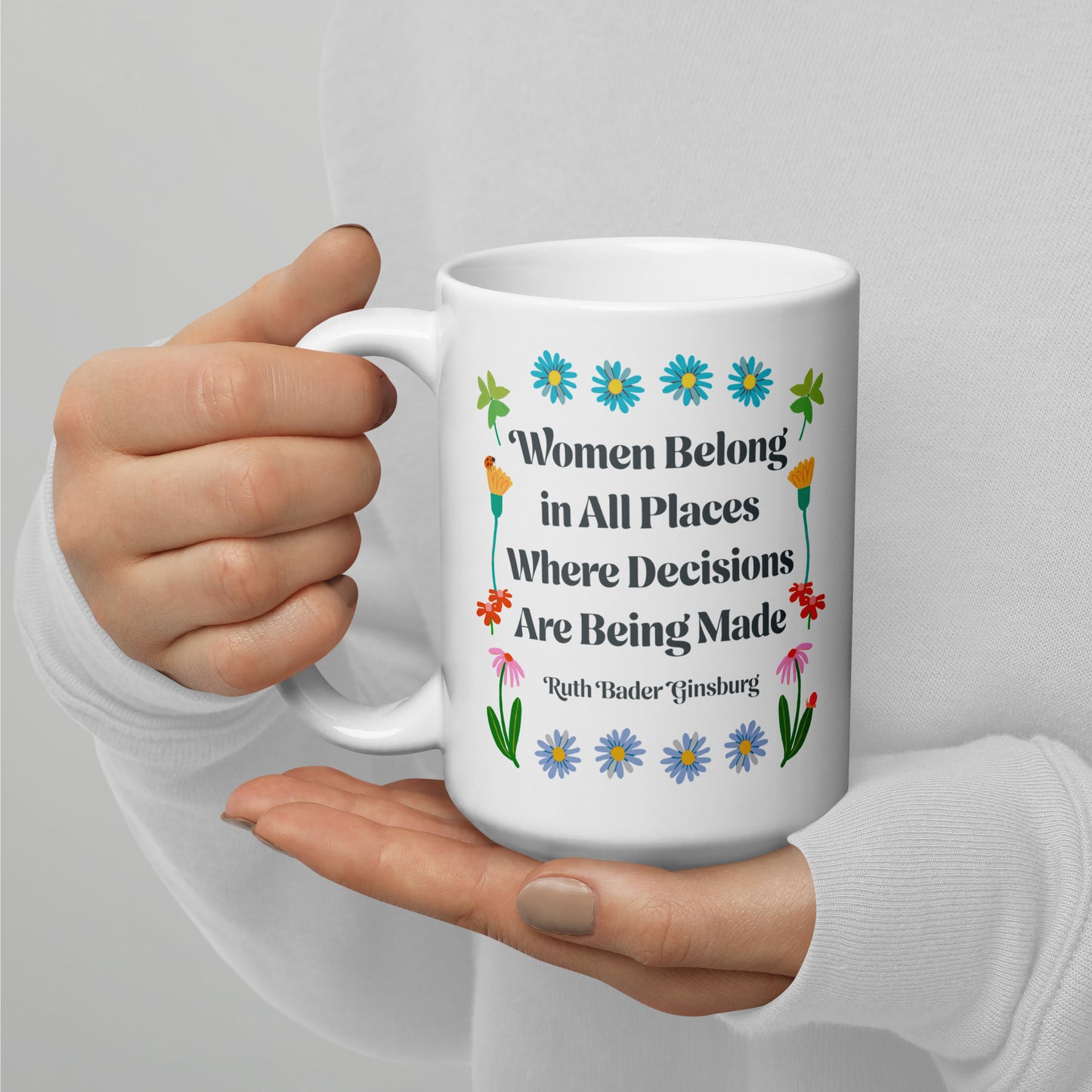 15 oz women Belong In All Places Where Decisions Are Being Made White Mug with floral design.