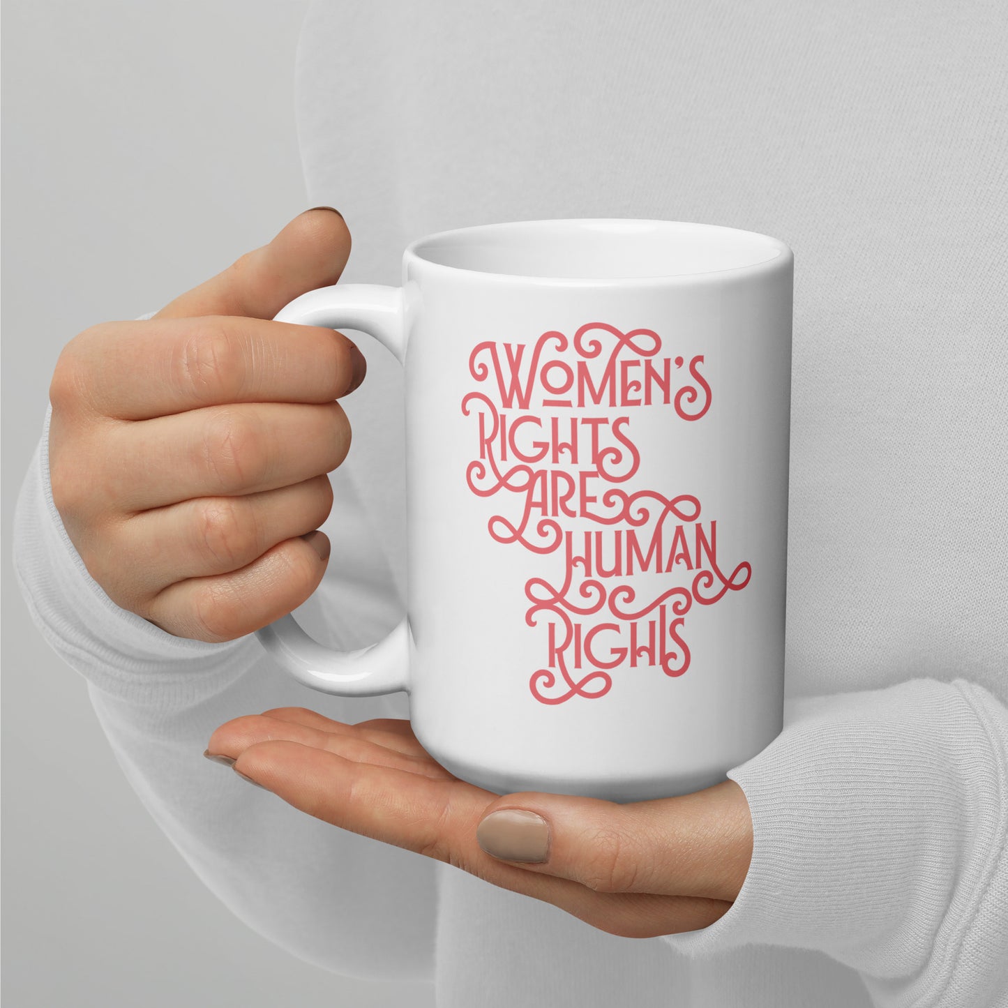 Lifestyle Image: A person holding the 15 oz feminist mug while enjoying coffee, supporting gender equality.