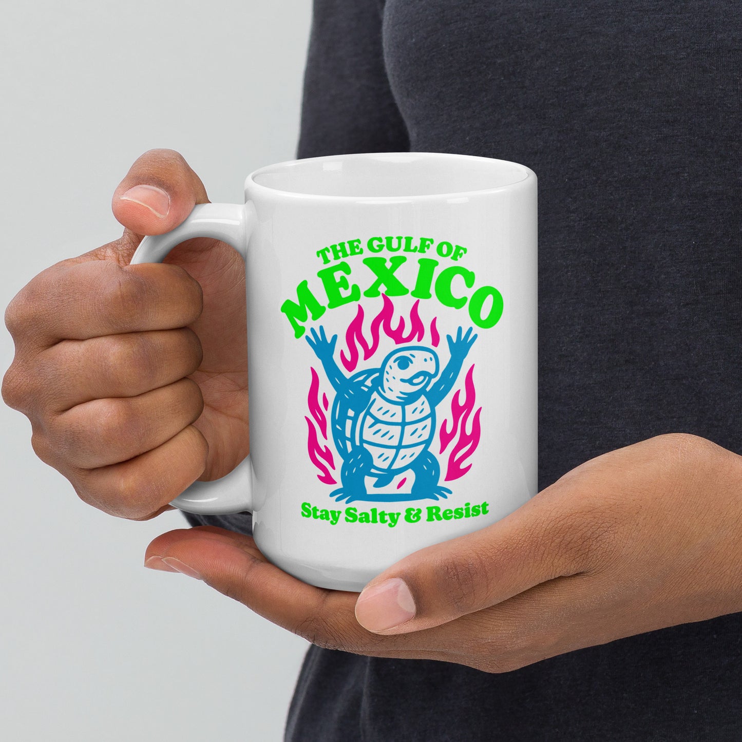 Front View Image: “Front view of 15 oz white ceramic mug featuring sea turtle and 'Stay Salty & Resist' slogan”