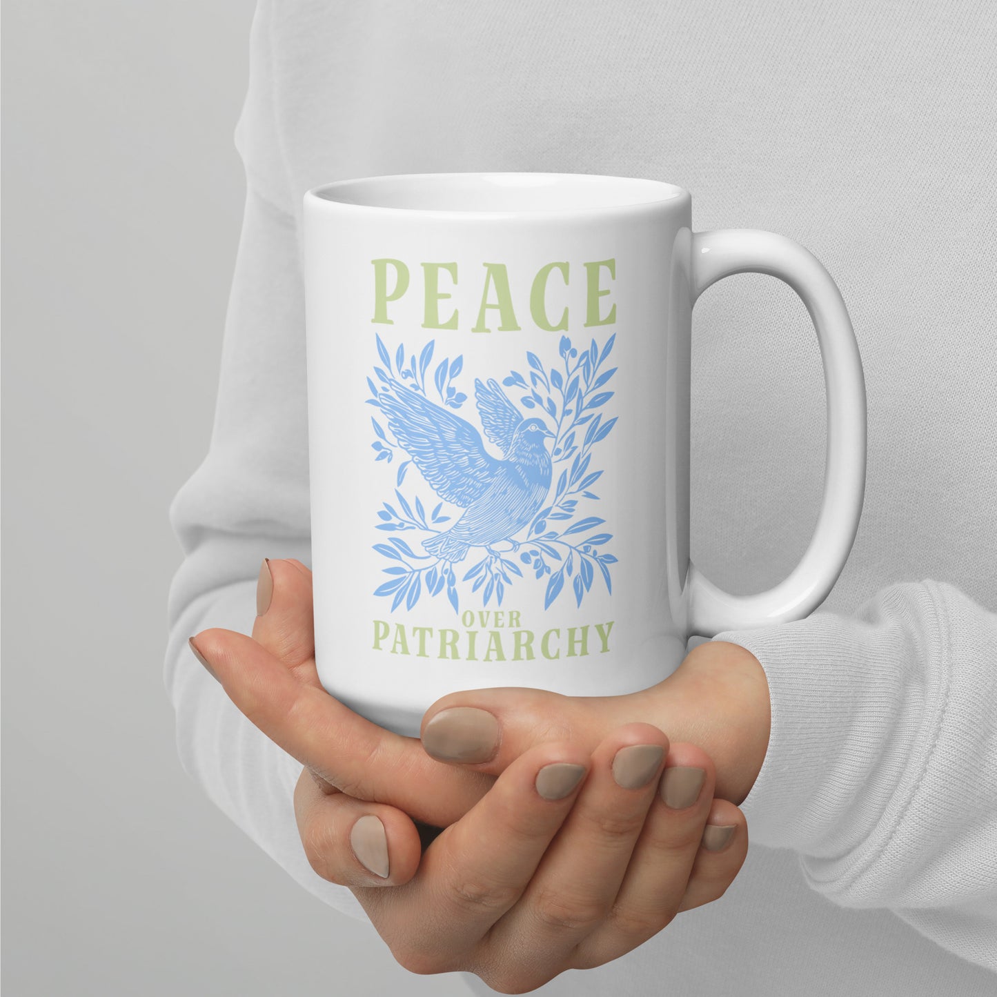Full view of the 15 oz Peace Over Patriarchy White Mug showcasing its bold message.