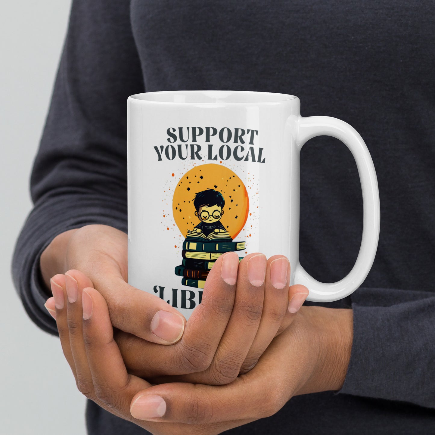 15 oz Support Your Local Library Mug held by a model.