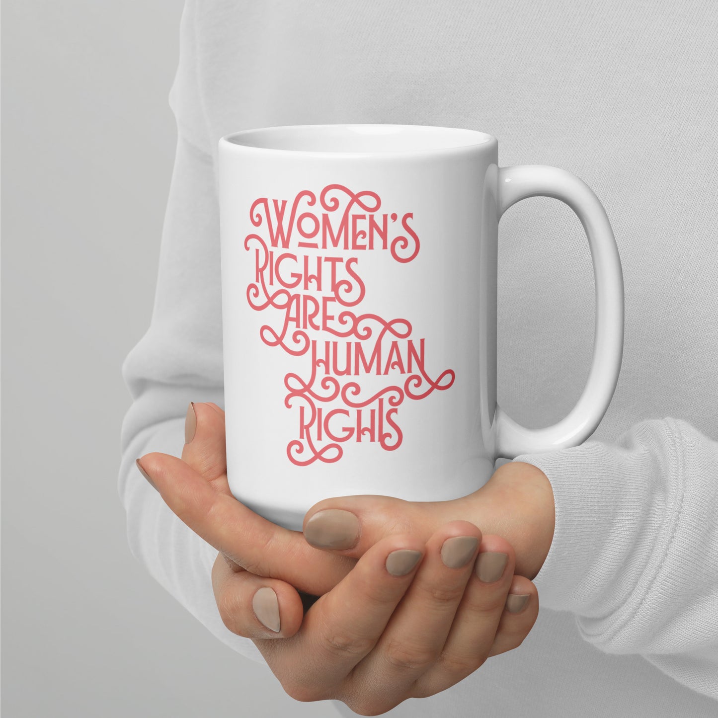 Lifestyle Image: A person holding the 15 oz feminist mug while enjoying coffee, supporting gender equality.